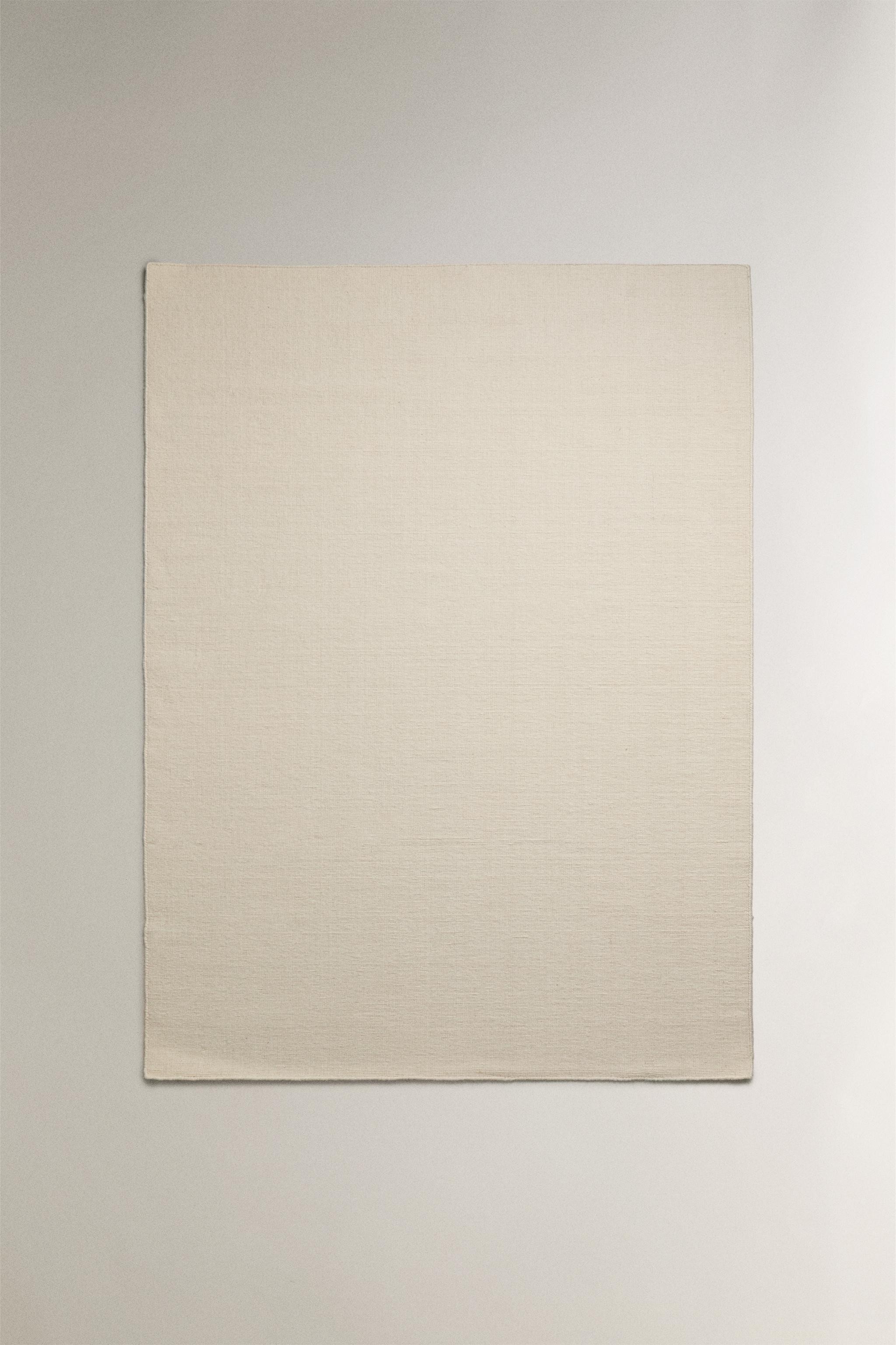 WOOL AREA RUG WITH SCALLOPED LINES