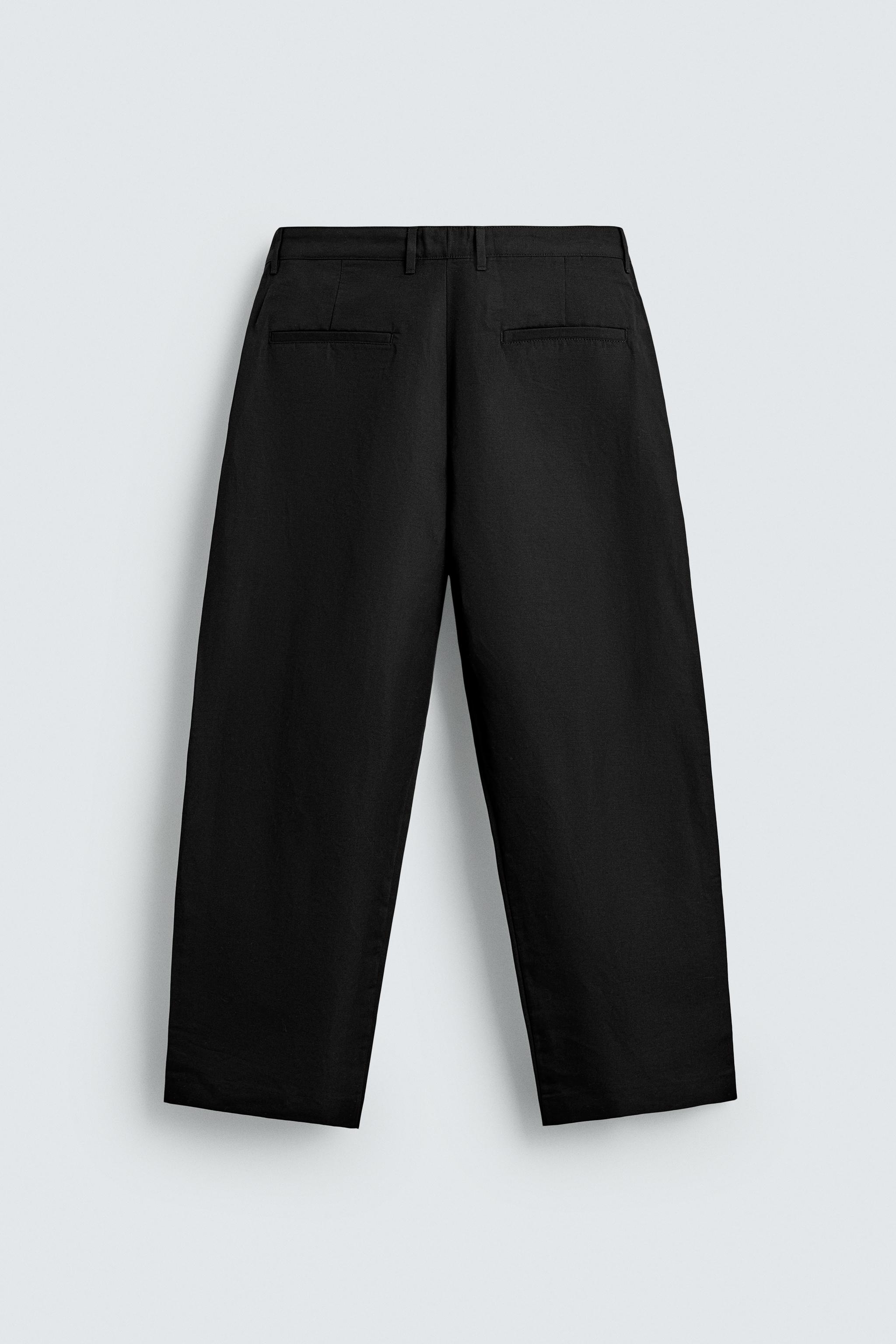 RELAXED FIT PLEATED PANTS