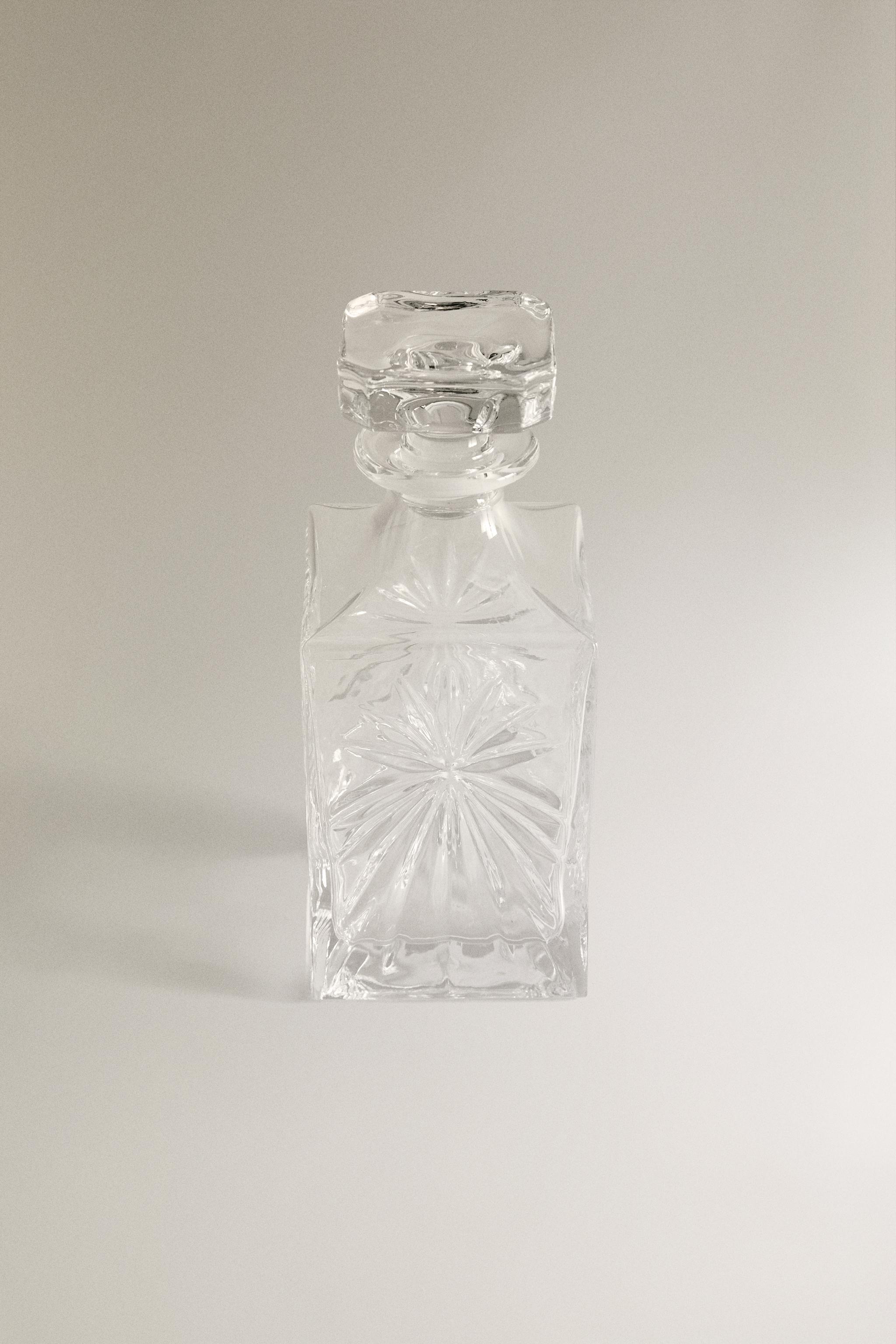 CRYSTALLINE BOTTLE WITH RAISED DESIGN