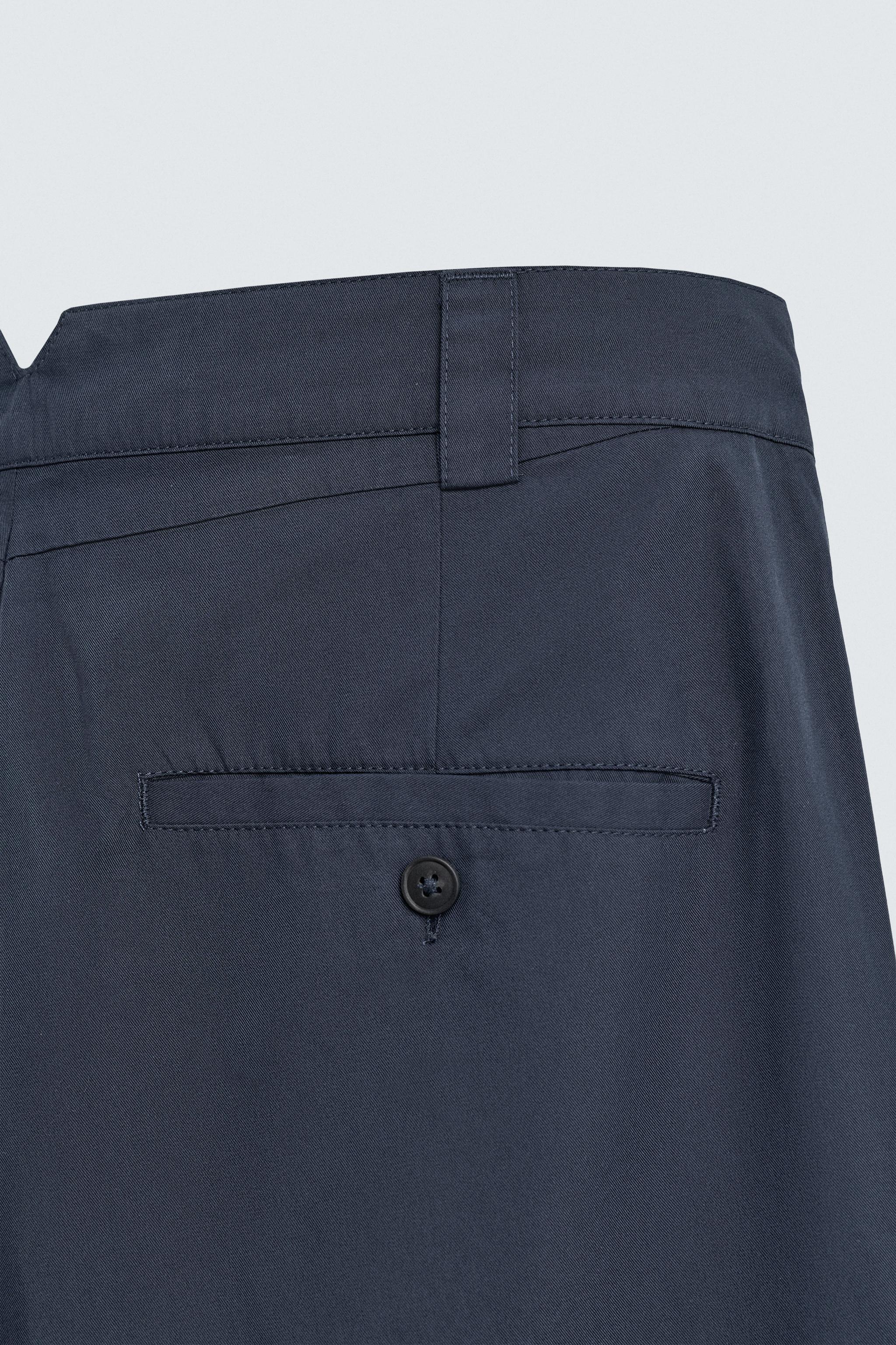 RELAXED FIT PLEATED PANTS