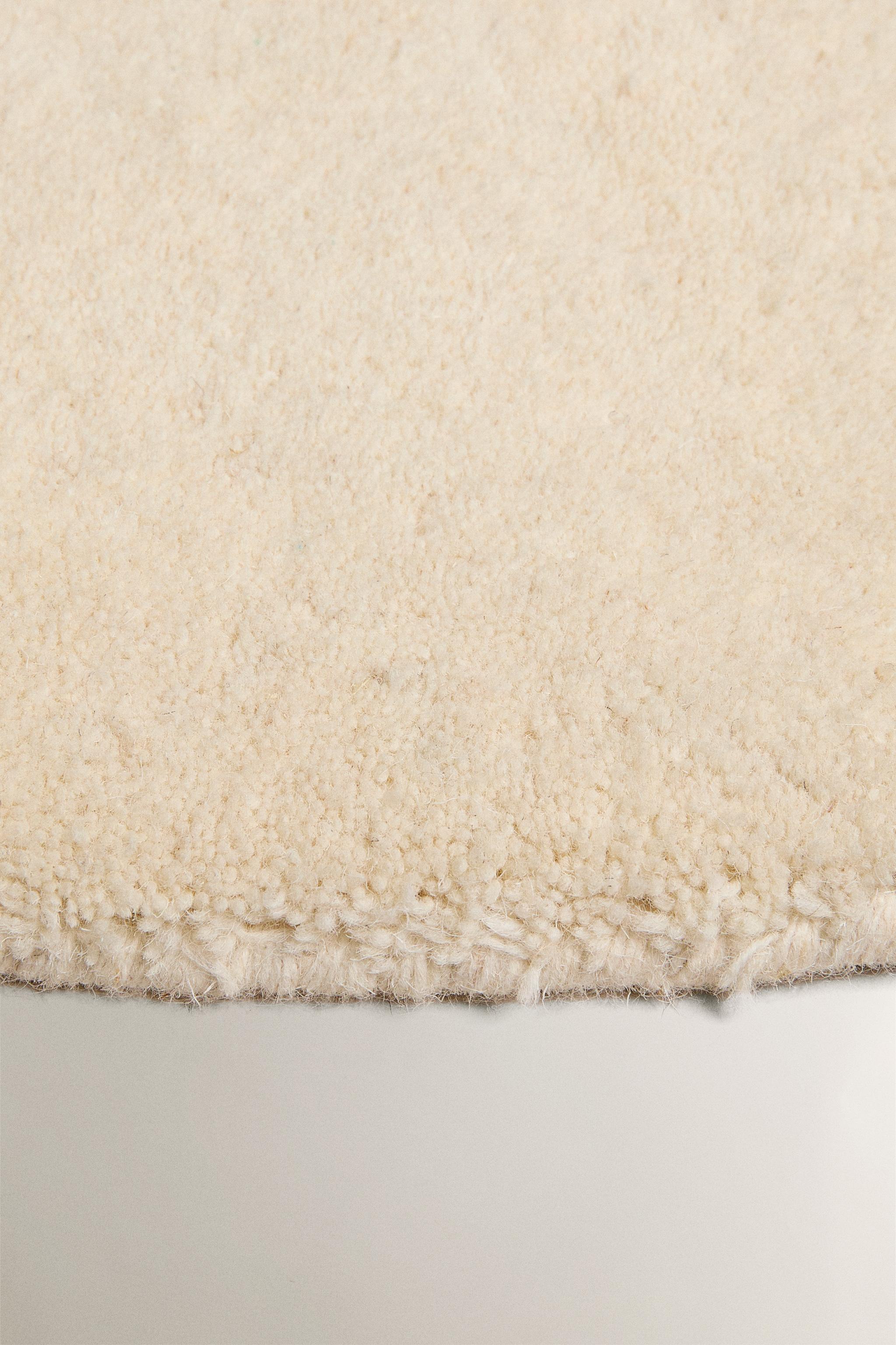 PLAIN IRREGULAR WOOL AREA RUG