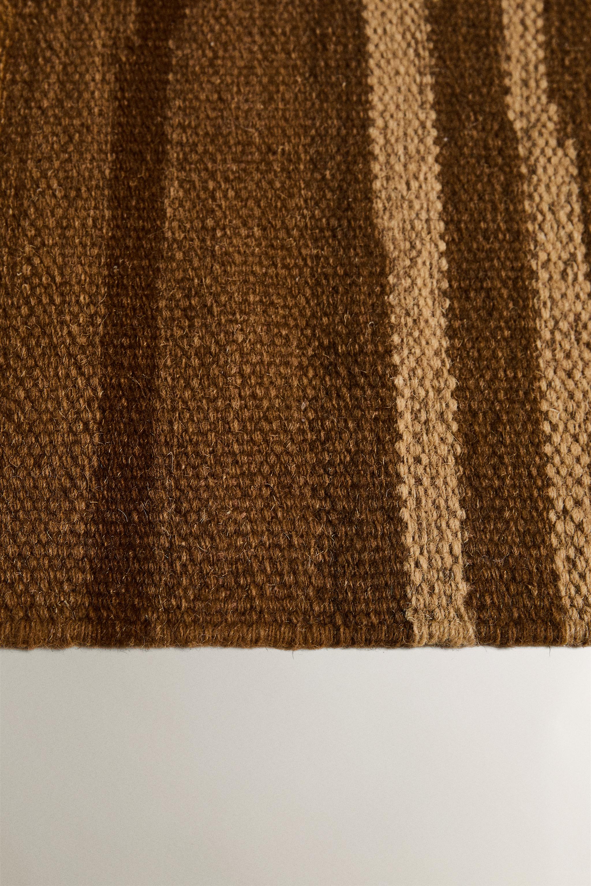 STRIPED AREA RUG WITH FRINGING