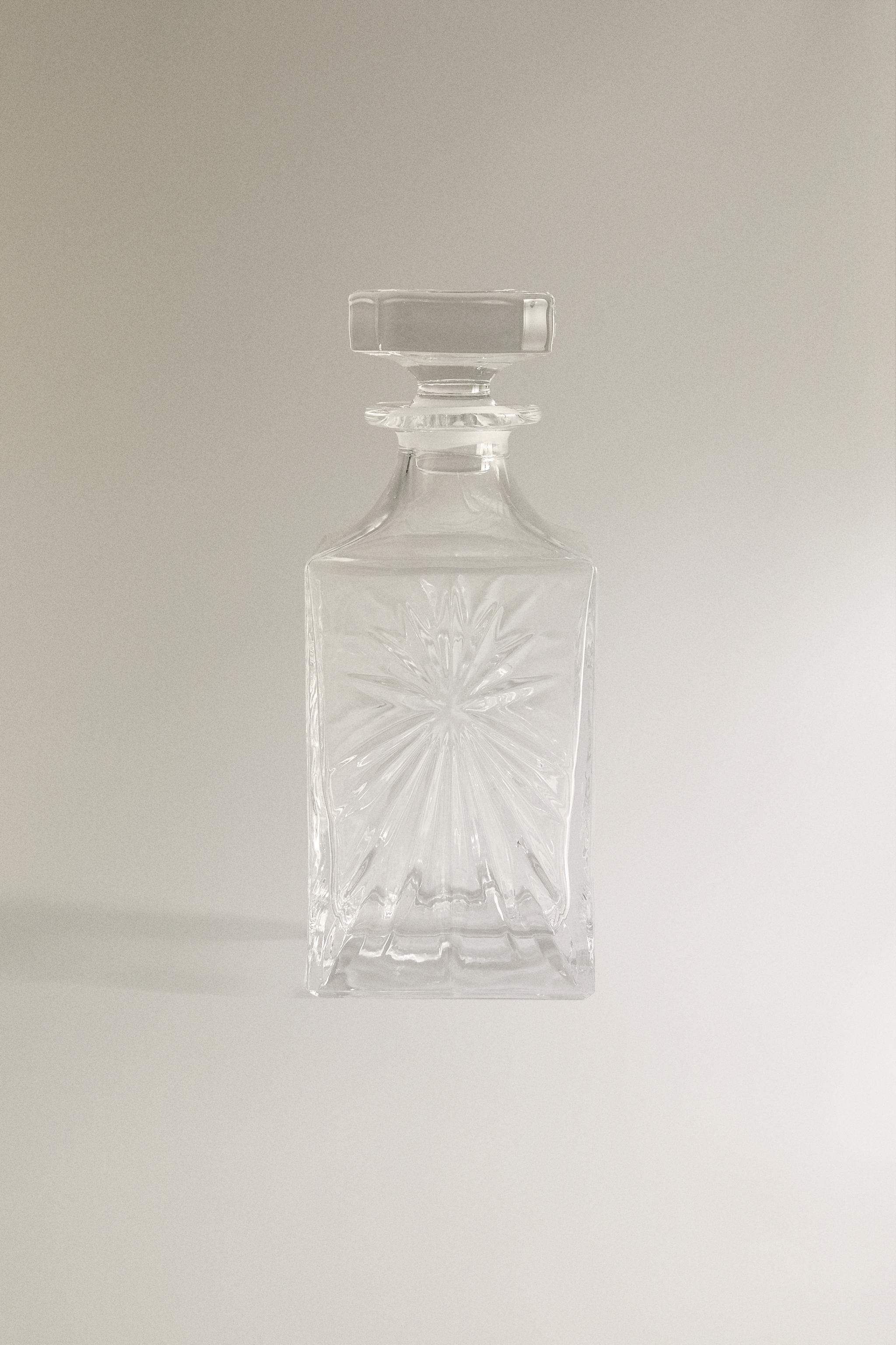 CRYSTALLINE BOTTLE WITH RAISED DESIGN