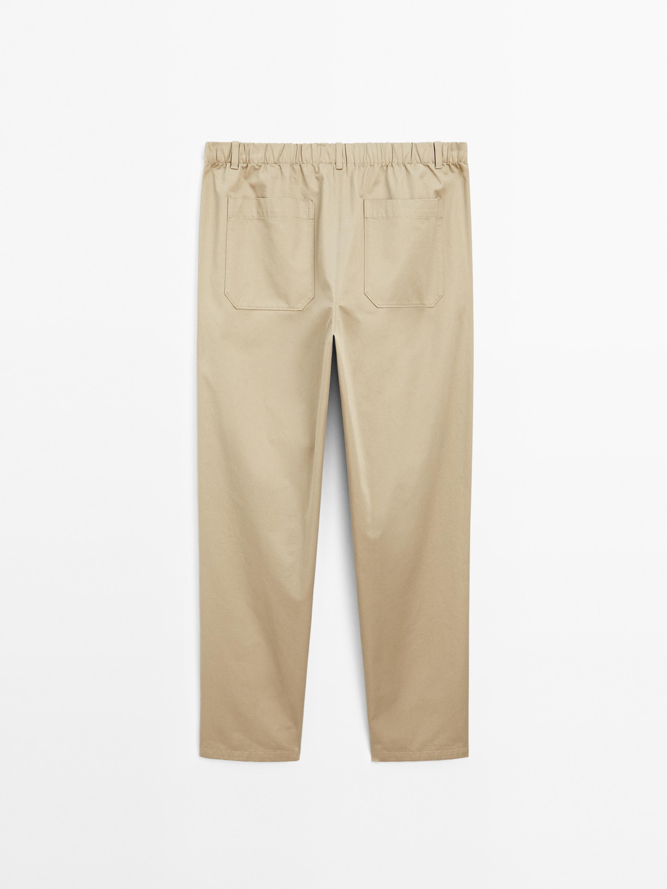 Trousers with patch pocket