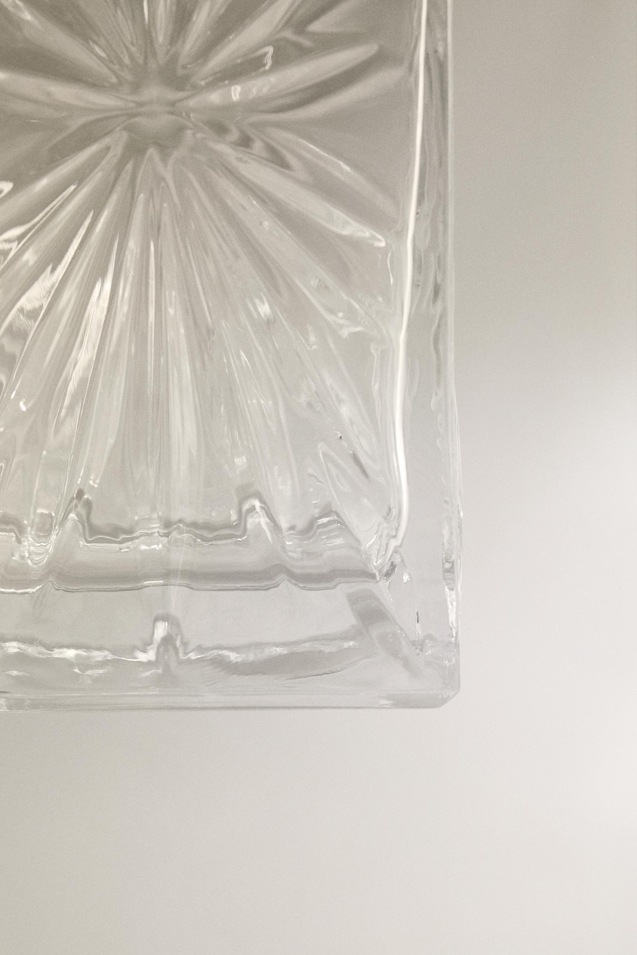CRYSTALLINE BOTTLE WITH RAISED DESIGN
