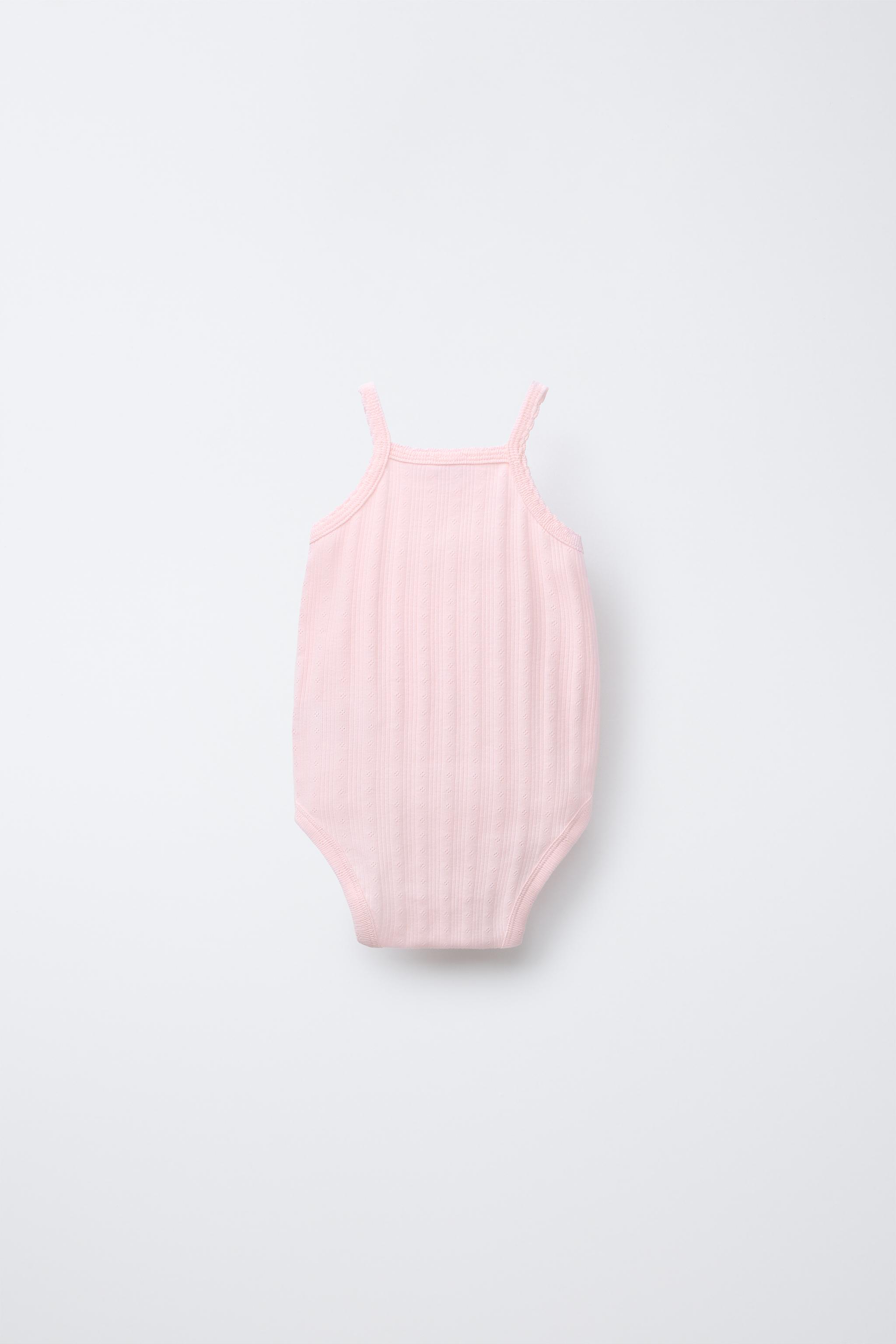 THREE-PACK OF RIB KNIT BODYSUITS WITH CUTOUT DETAIL