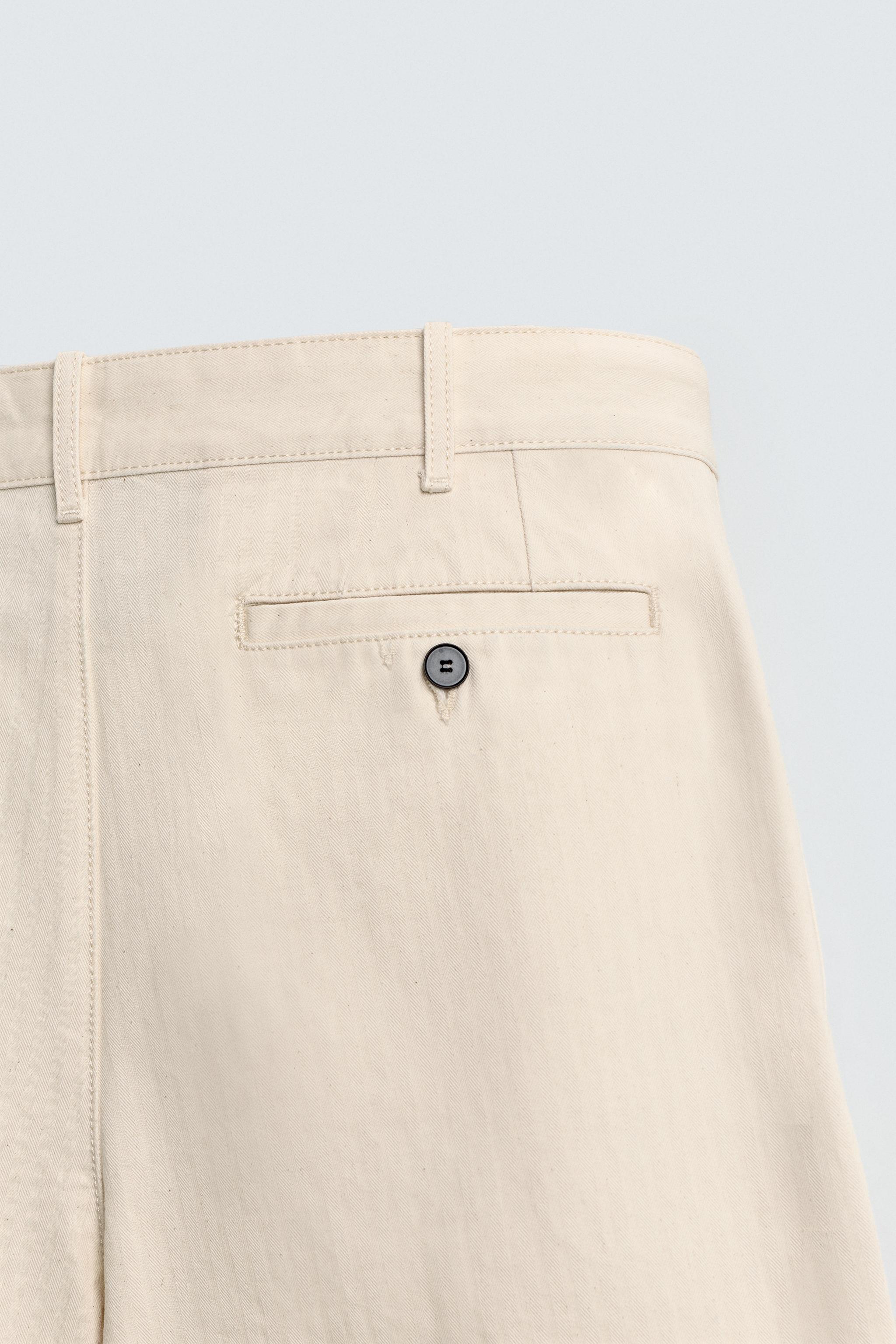 PLEATED HERRINGBONE PANTS