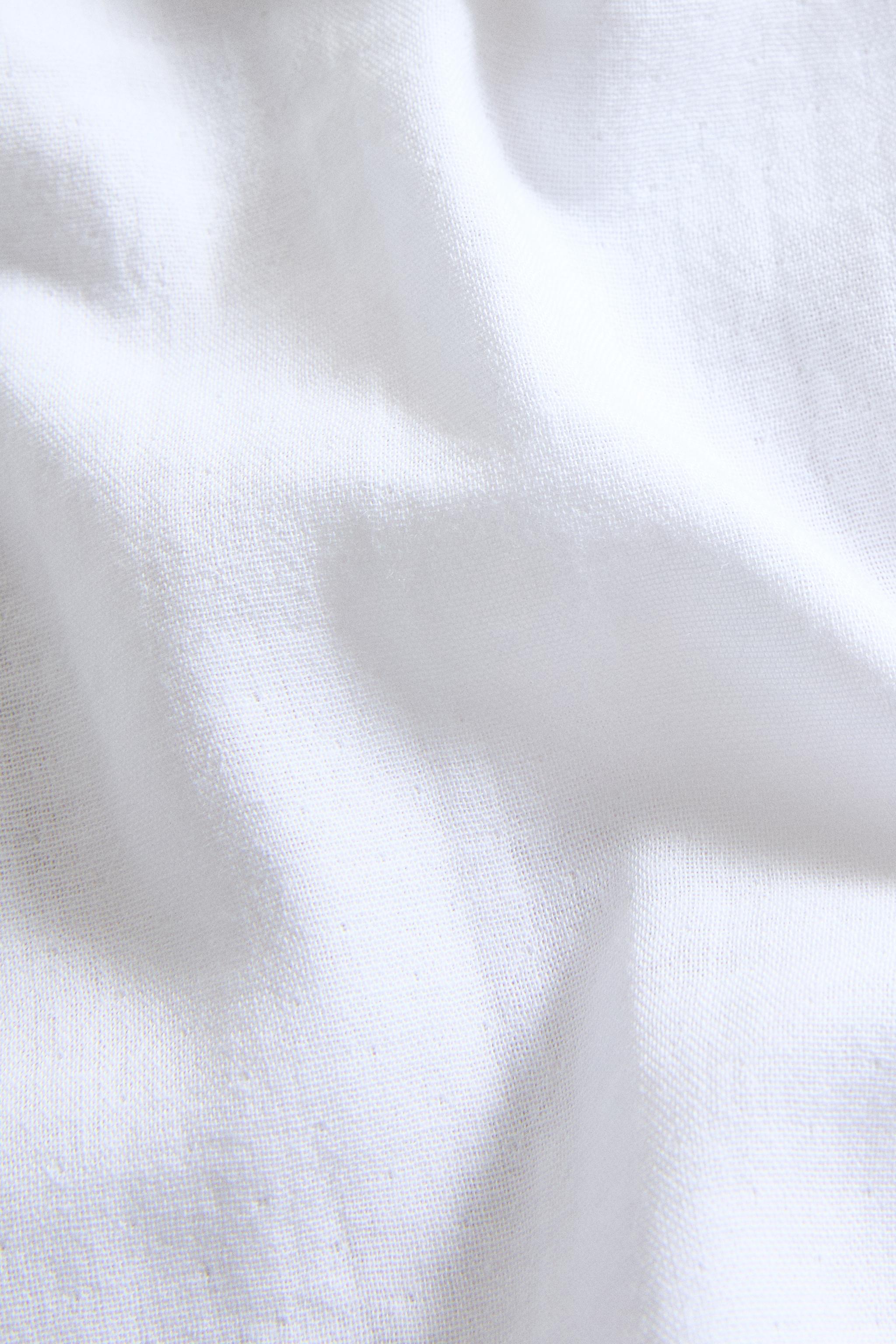 SET OF CHILDREN'S MUSLIN CLOTHS WITH FLORAL PIPING