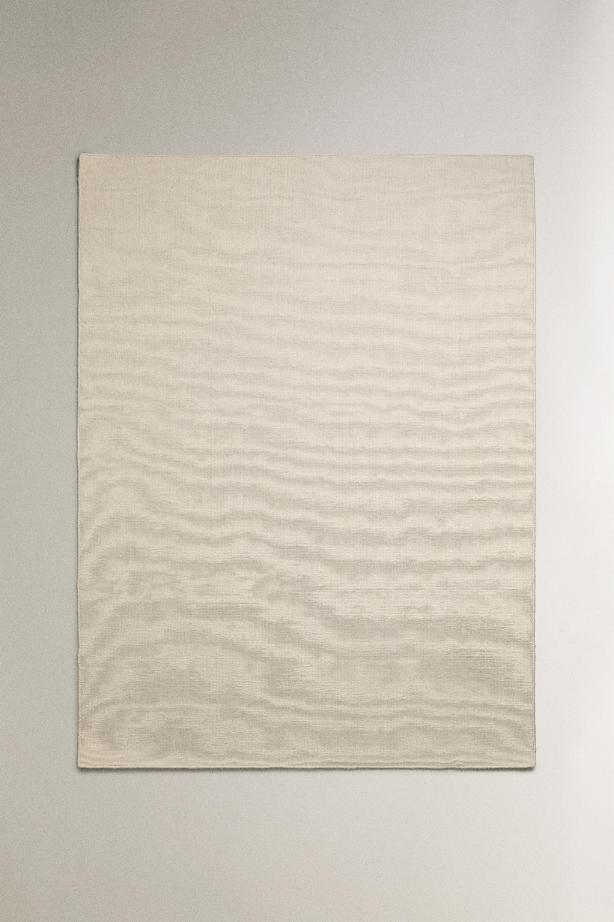 WOOL AREA RUG WITH SCALLOPED LINES