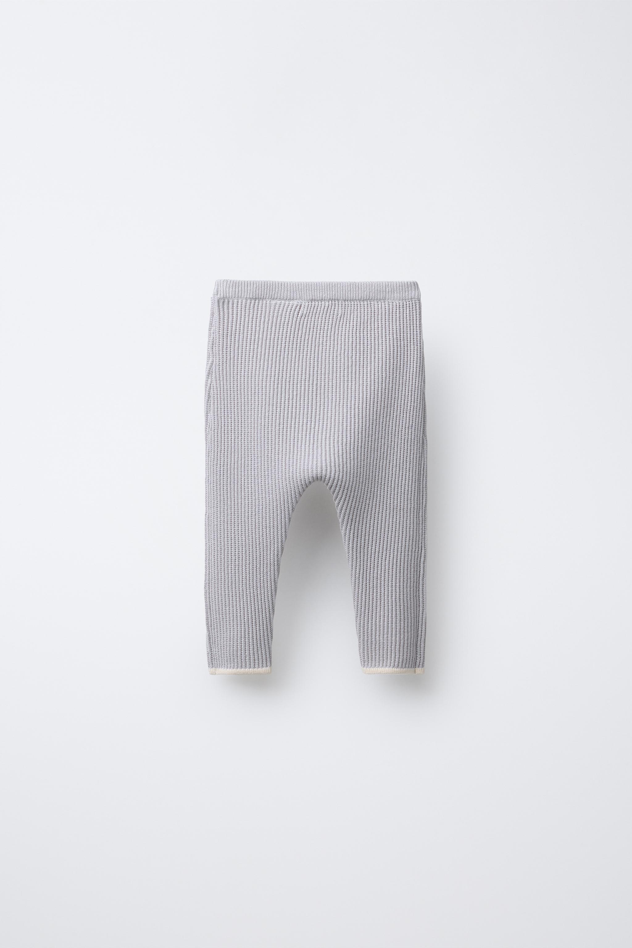 PANTS WITH CONTRASTING PIPING