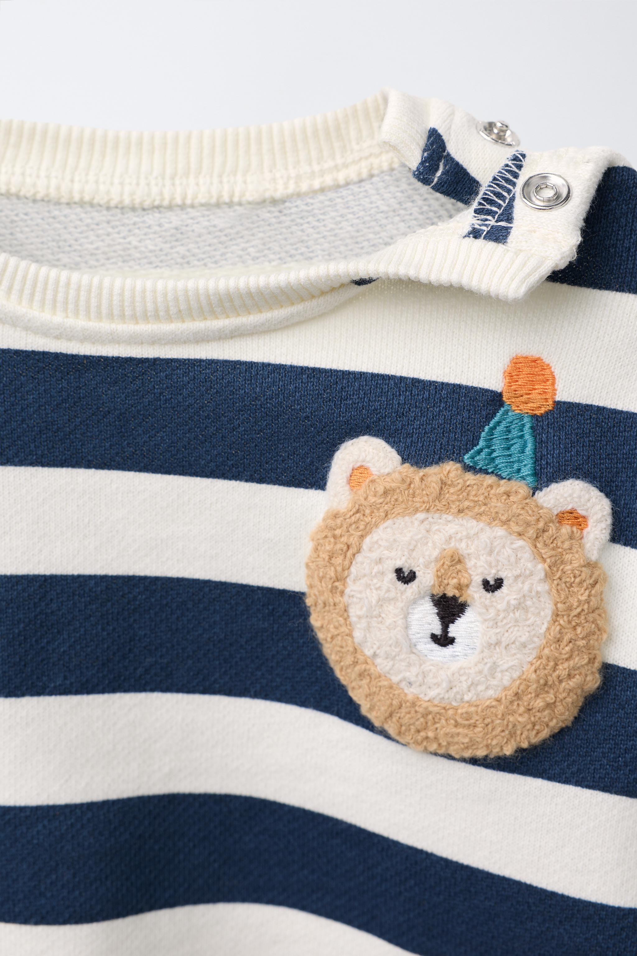 STRIPED SWEATSHIRT WITH LION PATCH