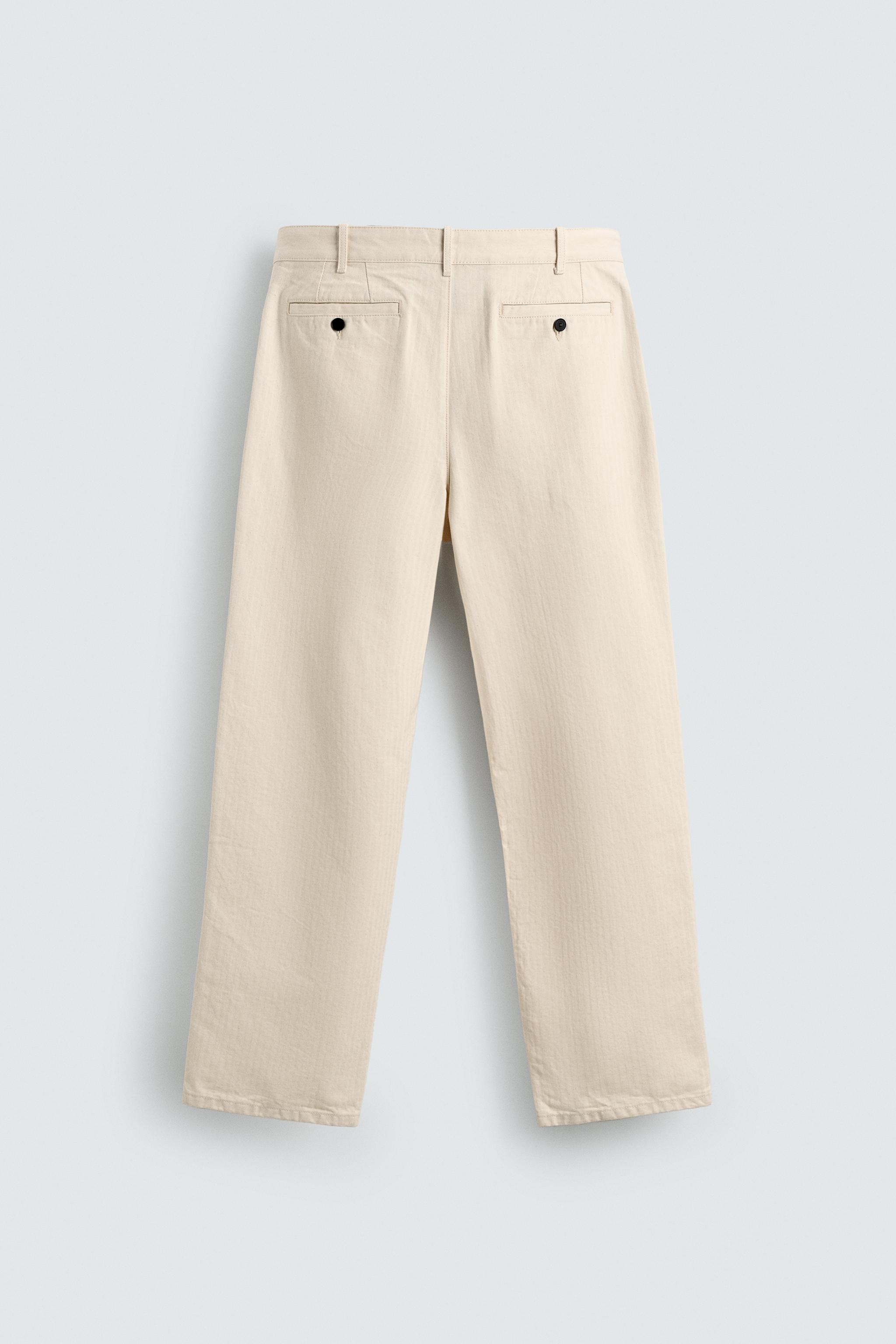 PLEATED HERRINGBONE PANTS