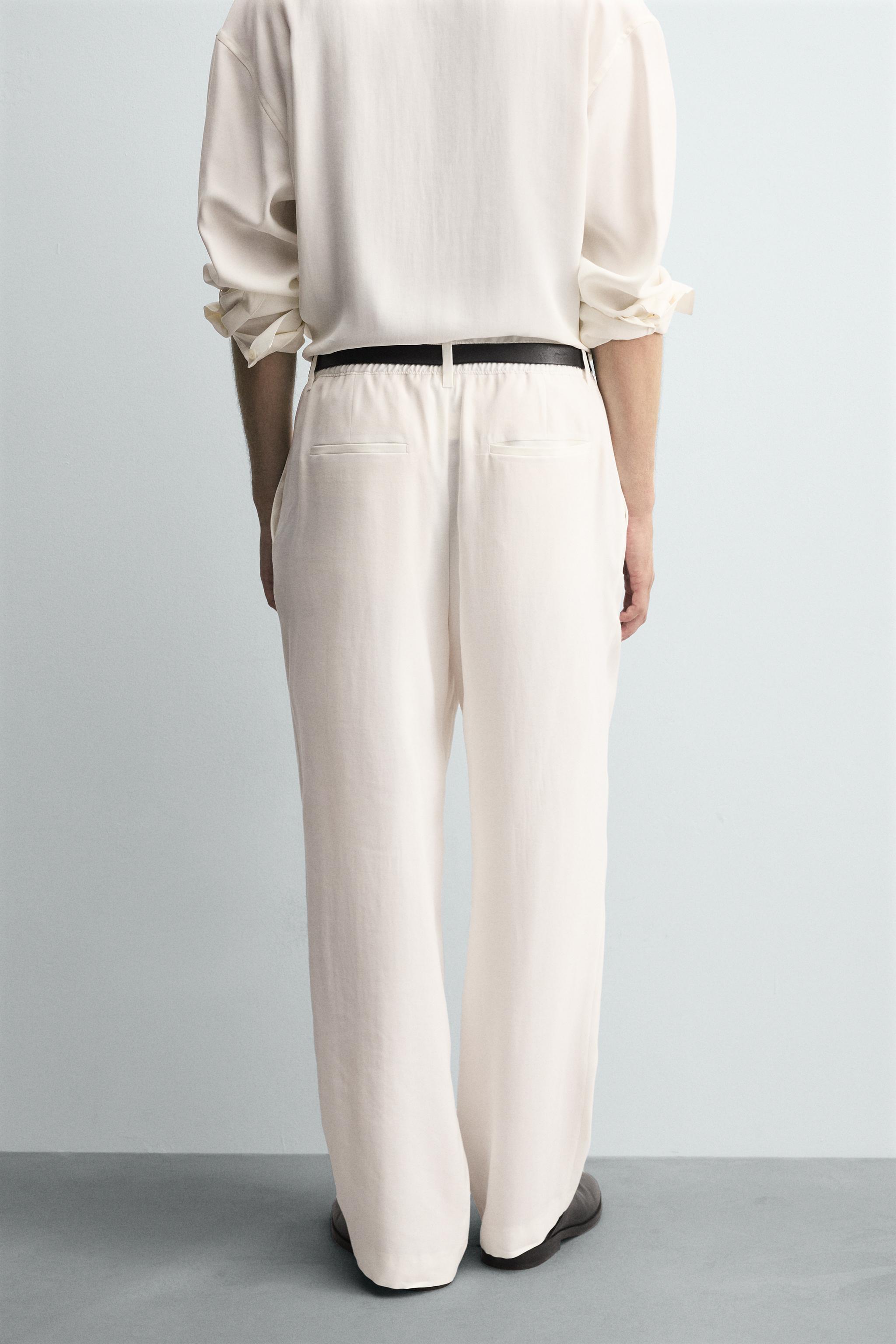 RELAXED FIT PLEATED PANTS