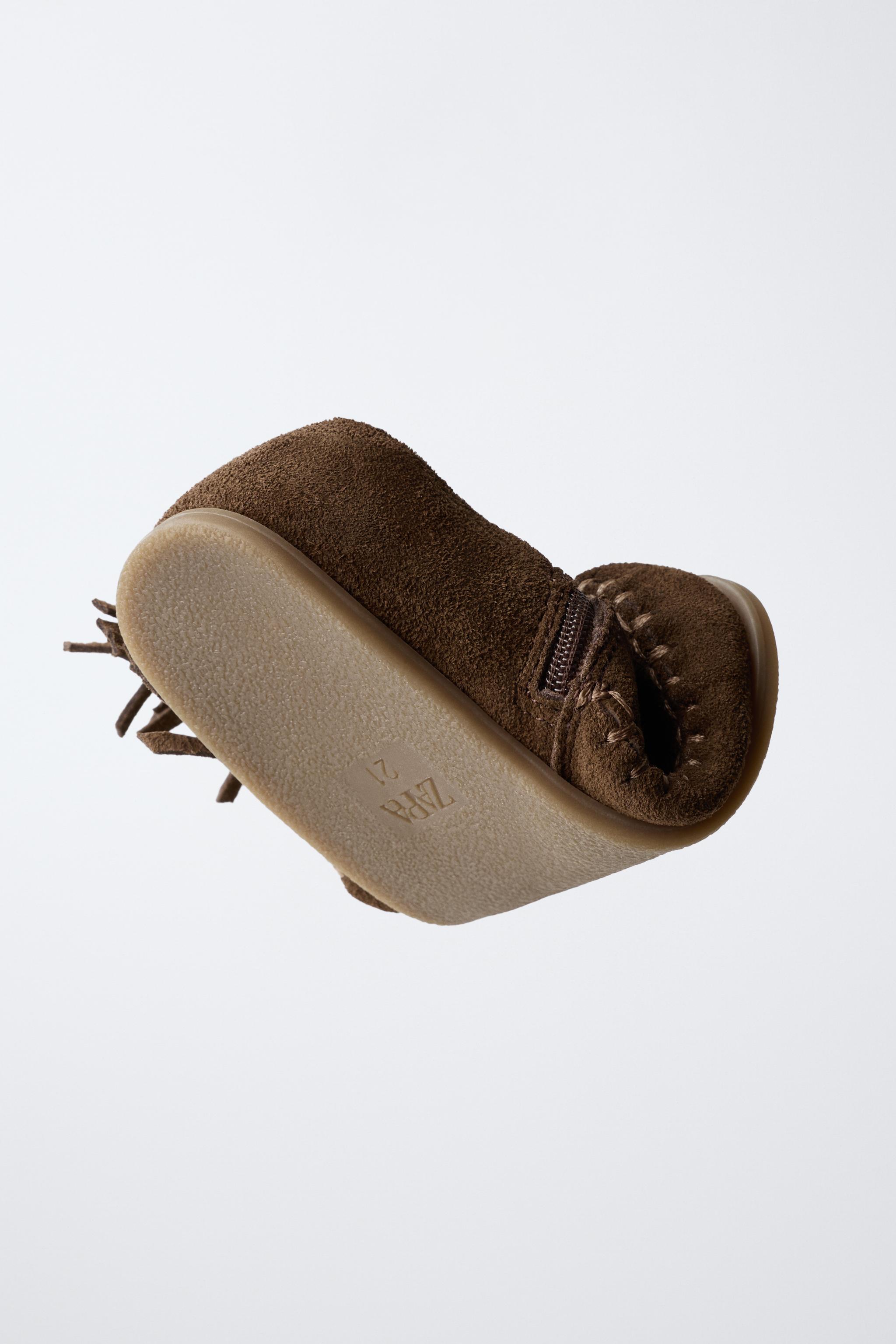 FRINGED LEATHER BOOTS