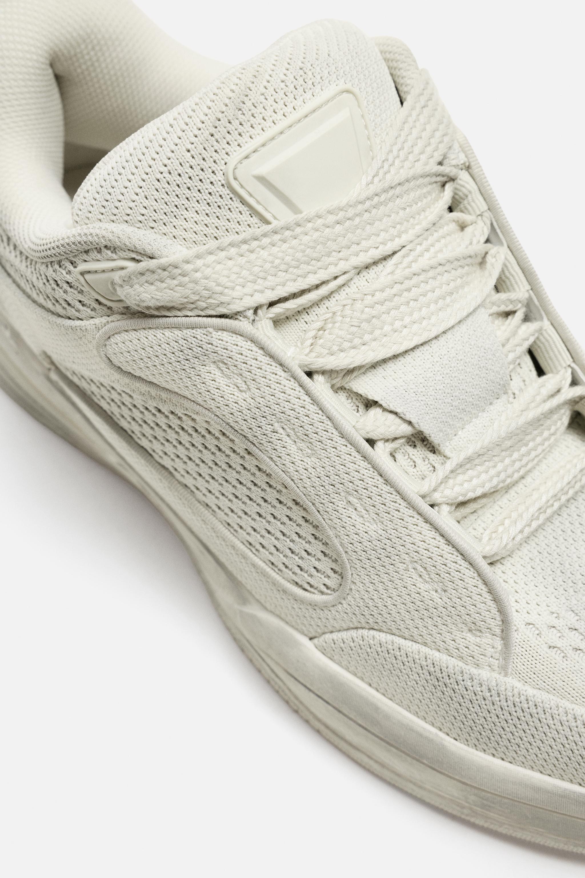 DISTRESSED THICK-SOLED SNEAKERS