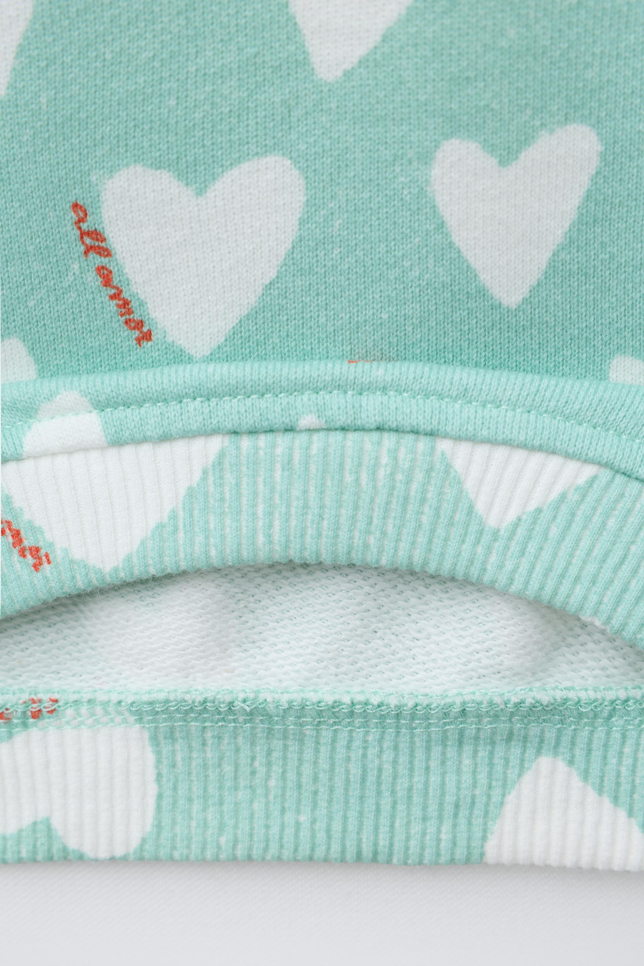 HEART PRINT SWEATSHIRT