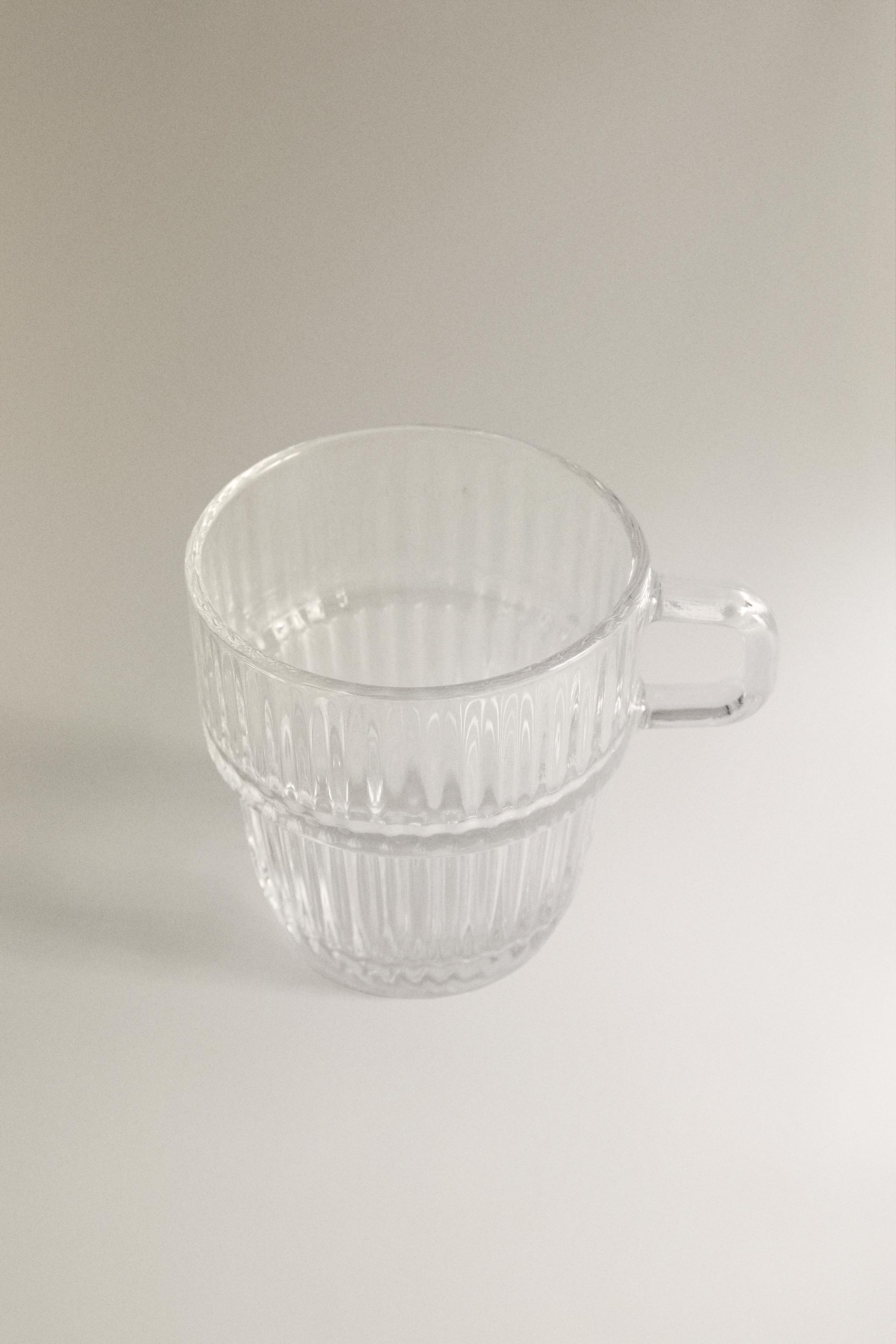 GLASS CUP WITH RAISED DESIGN
