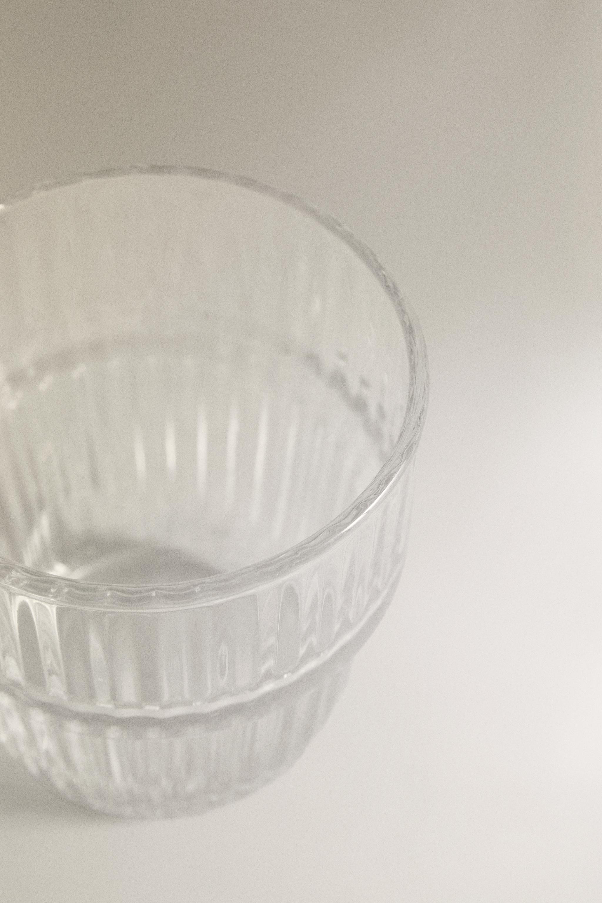 GLASS CUP WITH RAISED DESIGN