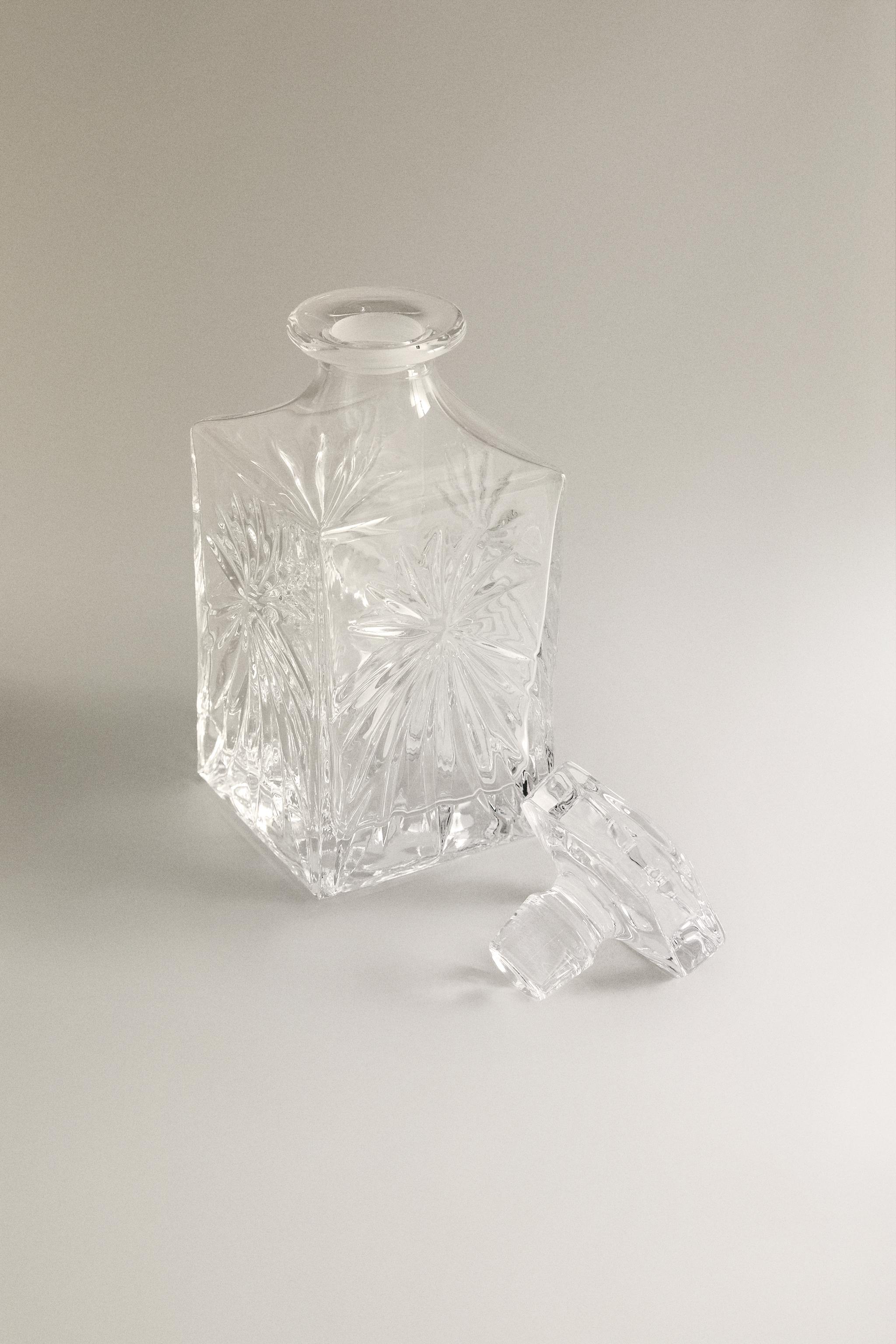 CRYSTALLINE BOTTLE WITH RAISED DESIGN