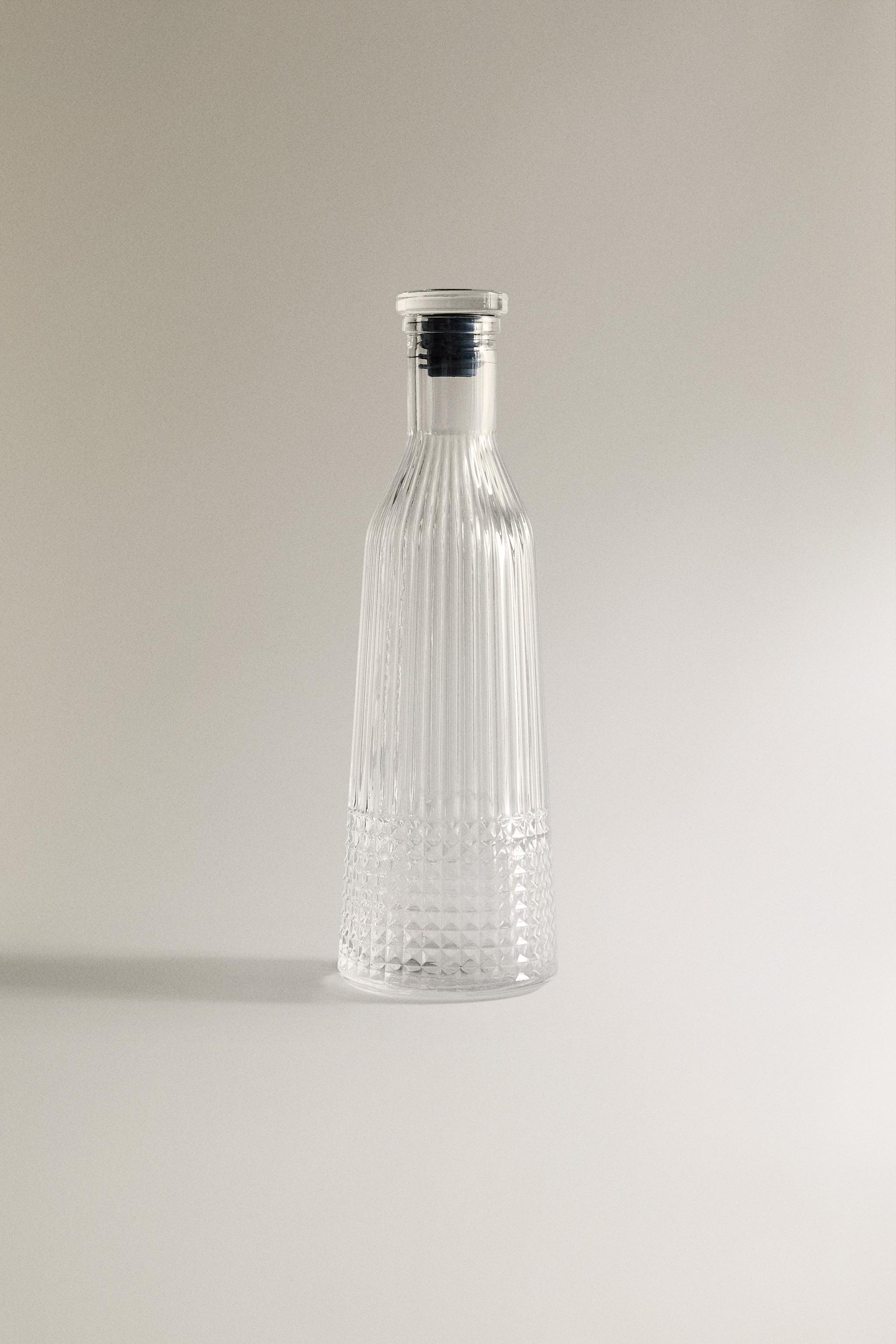RAISED DESIGN GLASS BOTTLE