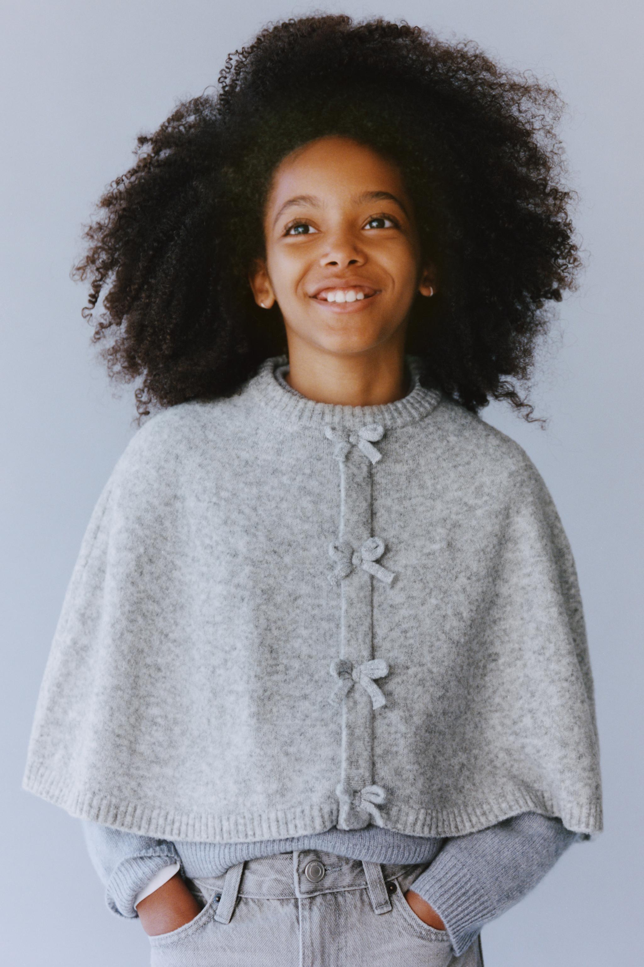 CAPE PONCHO WITH BOWS