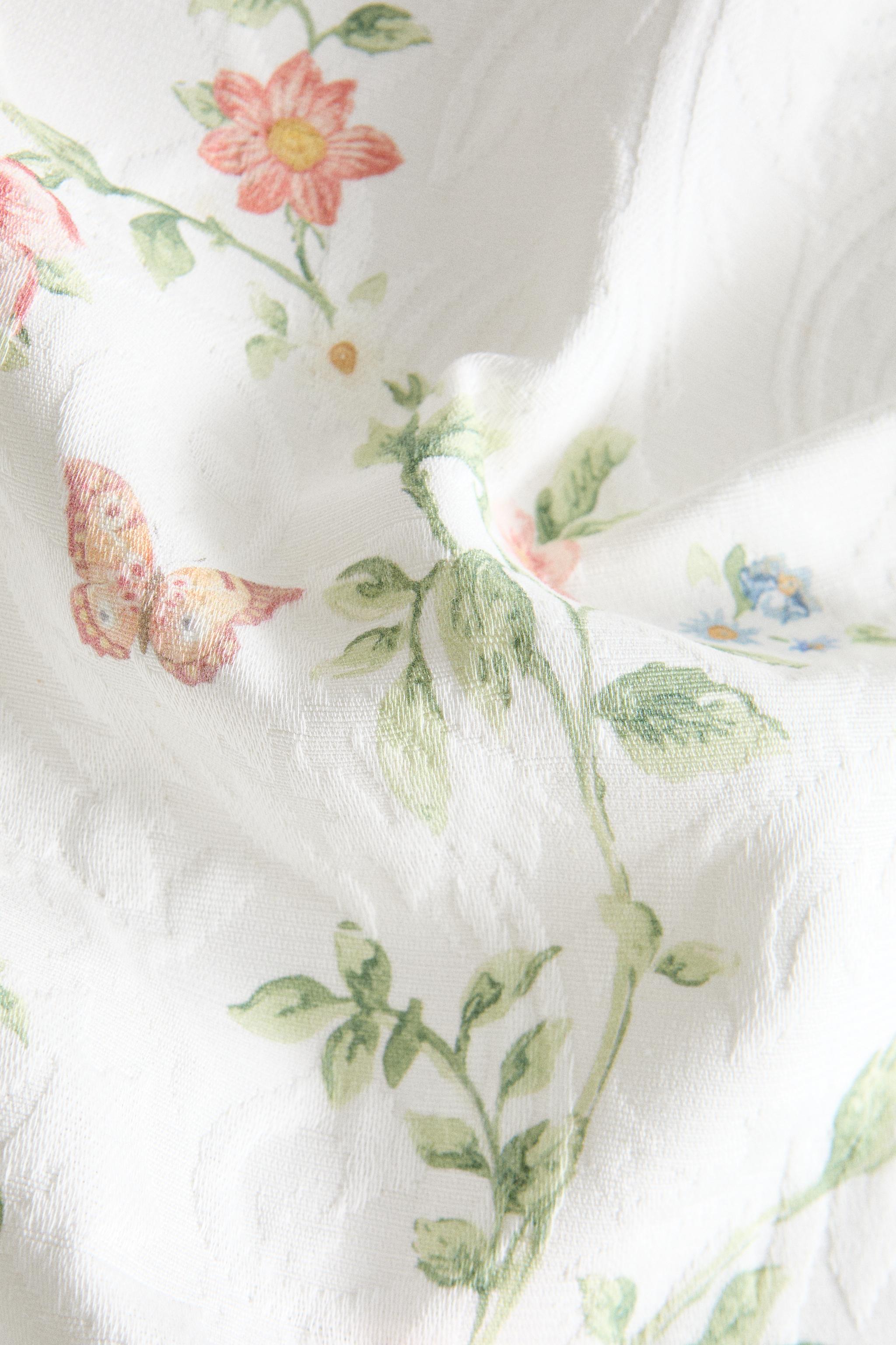 JACQUARD TABLE RUNNER WITH A FLORAL PRINT