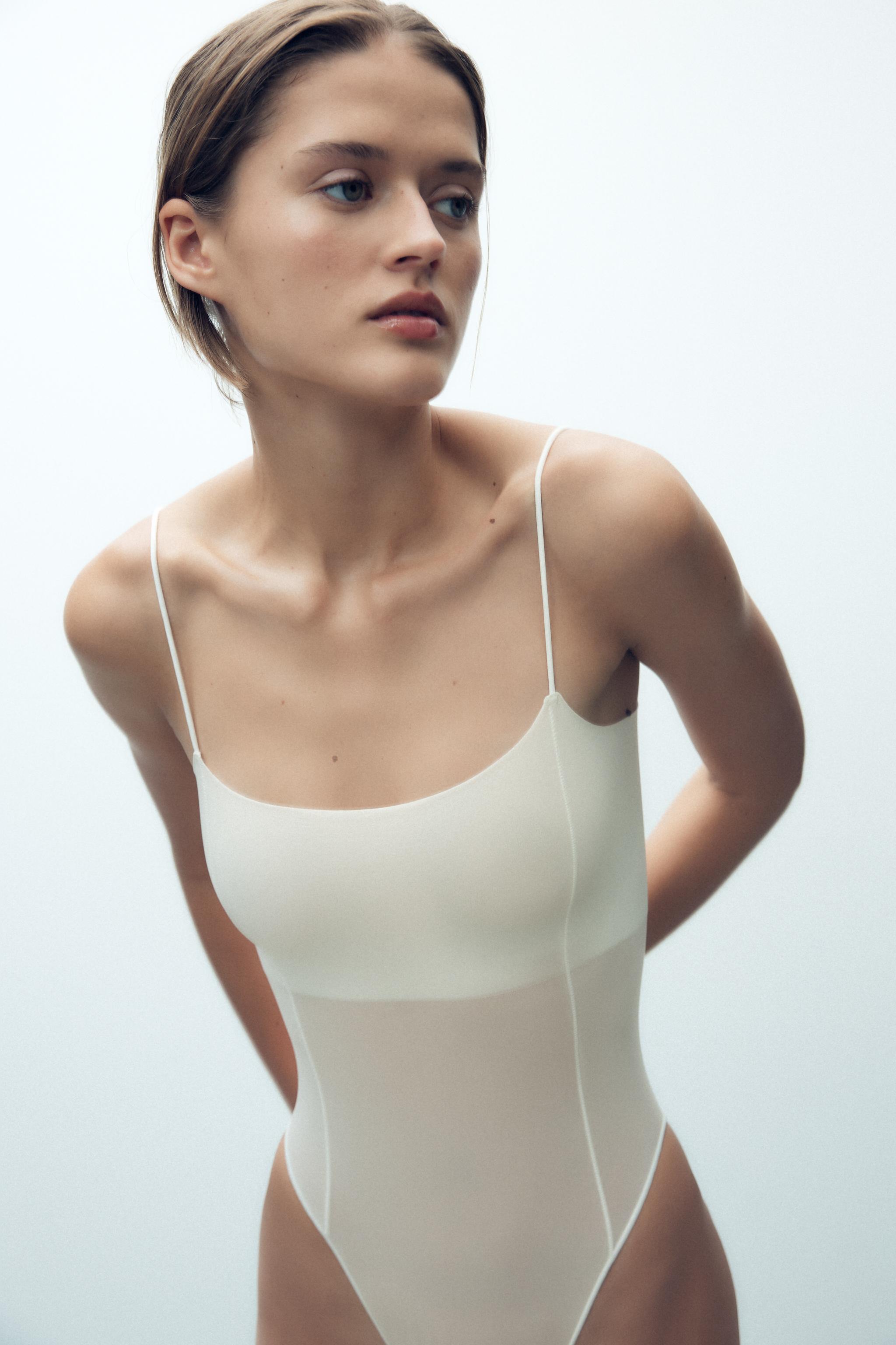 FITTED STRAPPY BODYSUIT WITH SEAMS