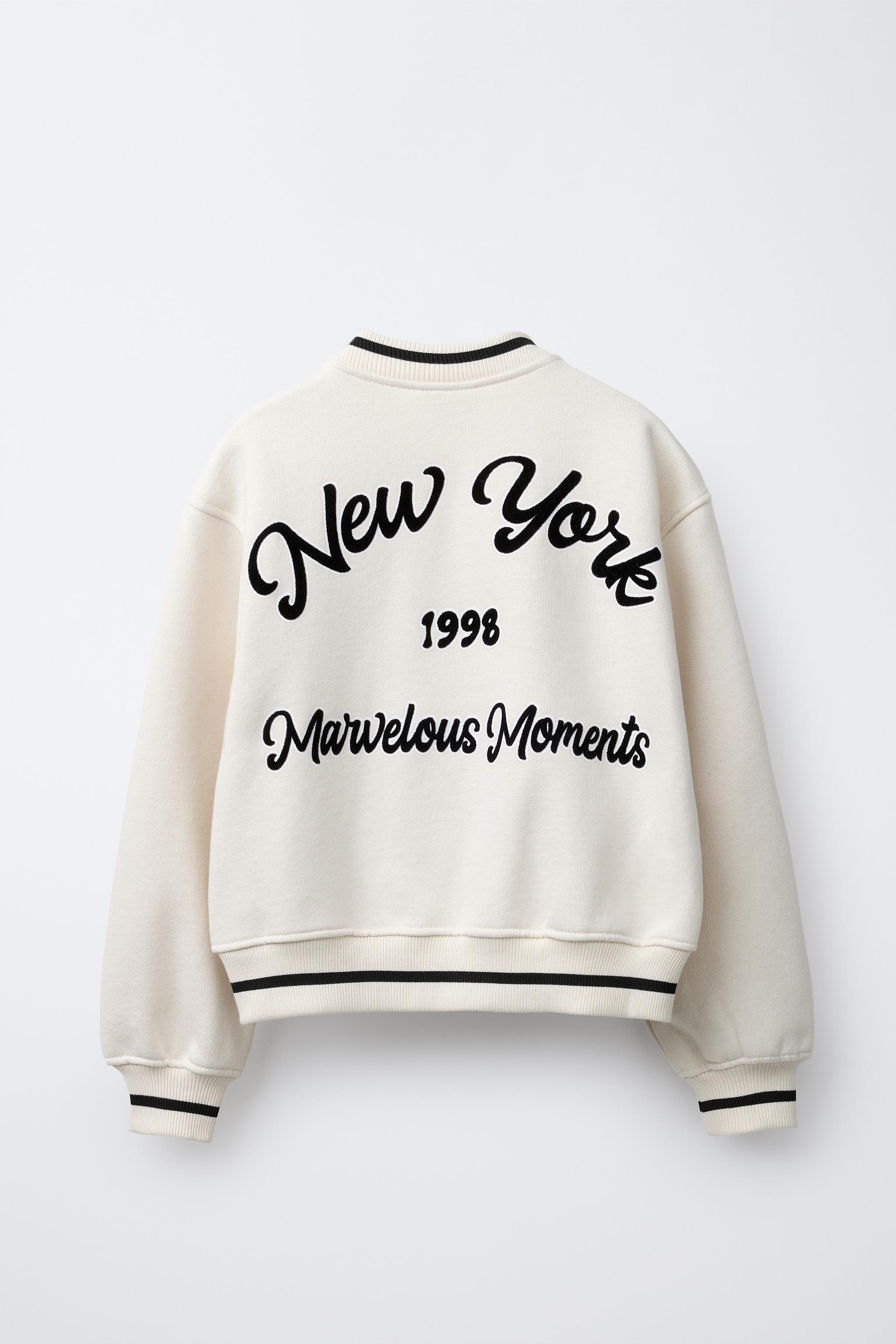 PLUSH BOMBER JACKET WITH EMBROIDERED TEXT