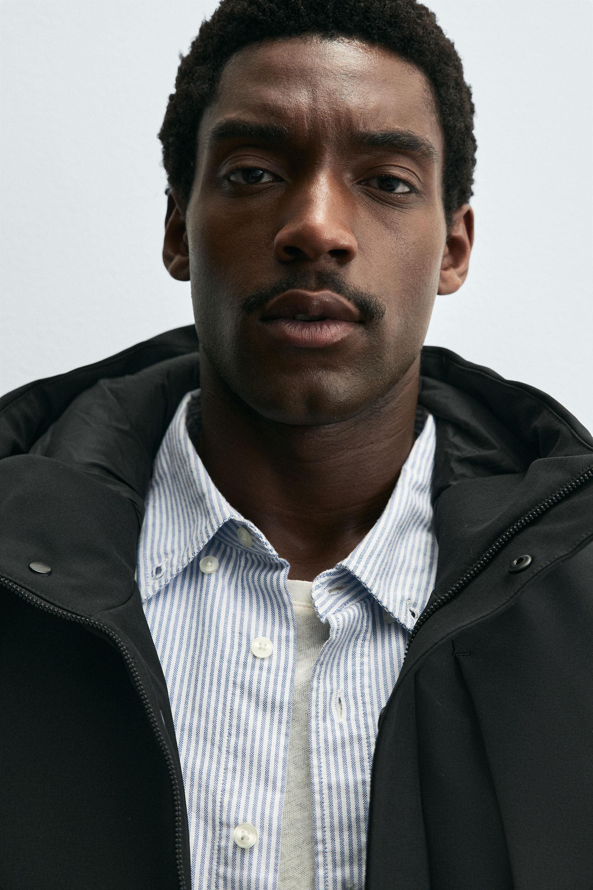 HOODED TECHNICAL JACKET