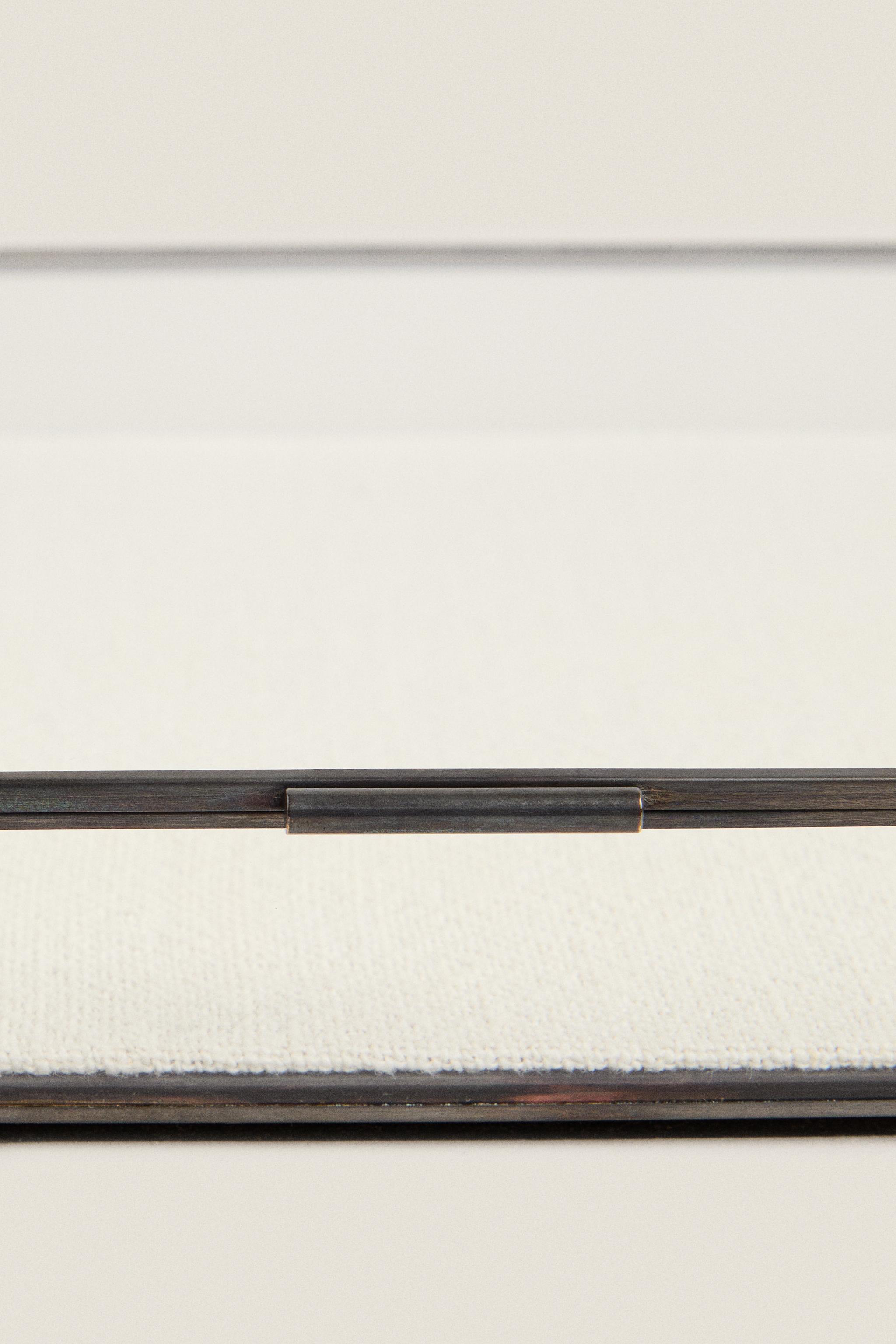 JEWELRY BOX WITH A BLACK METAL BORDER