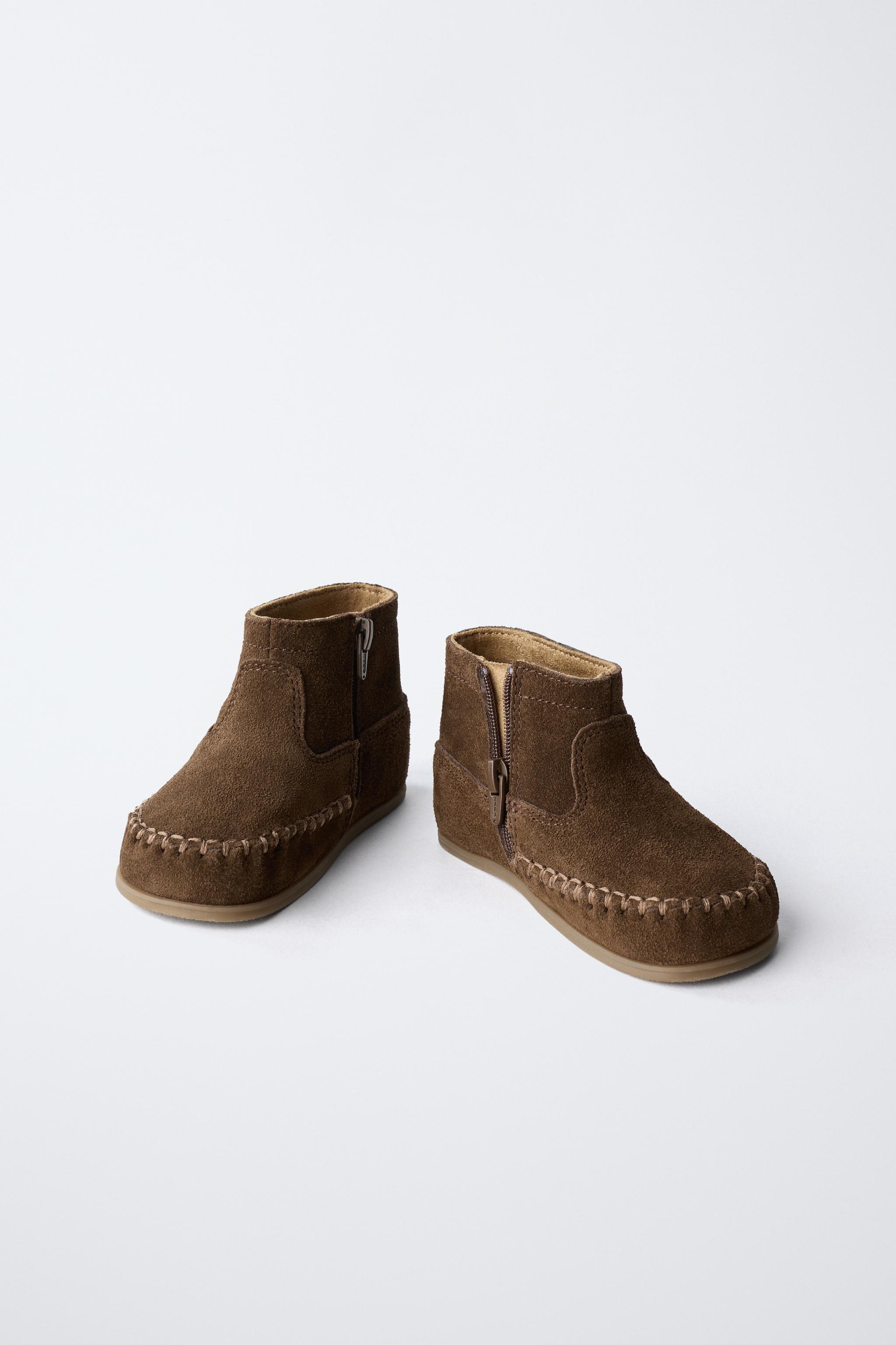 FRINGED LEATHER BOOTS