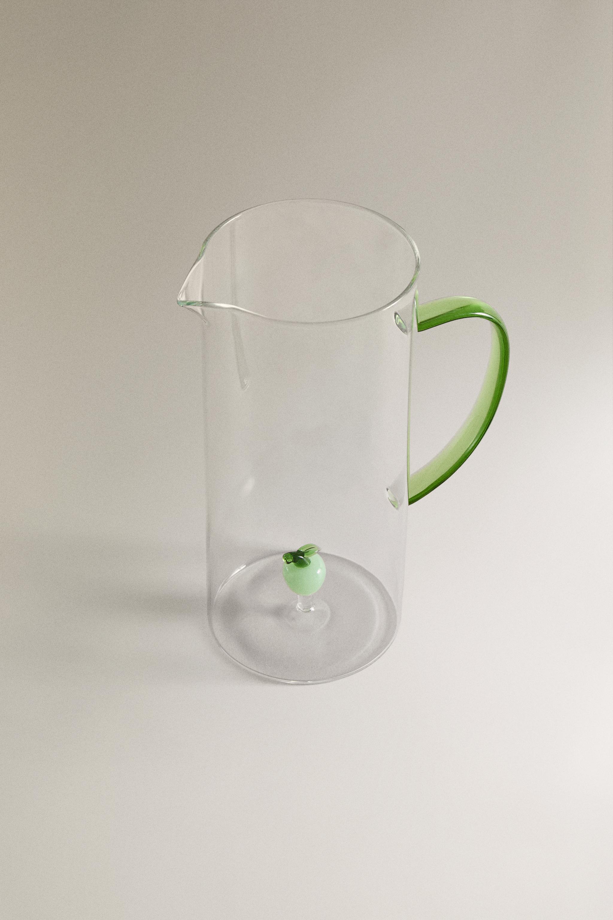 GLASS PITCHER WITH HANDLE AND APPLE DETAIL