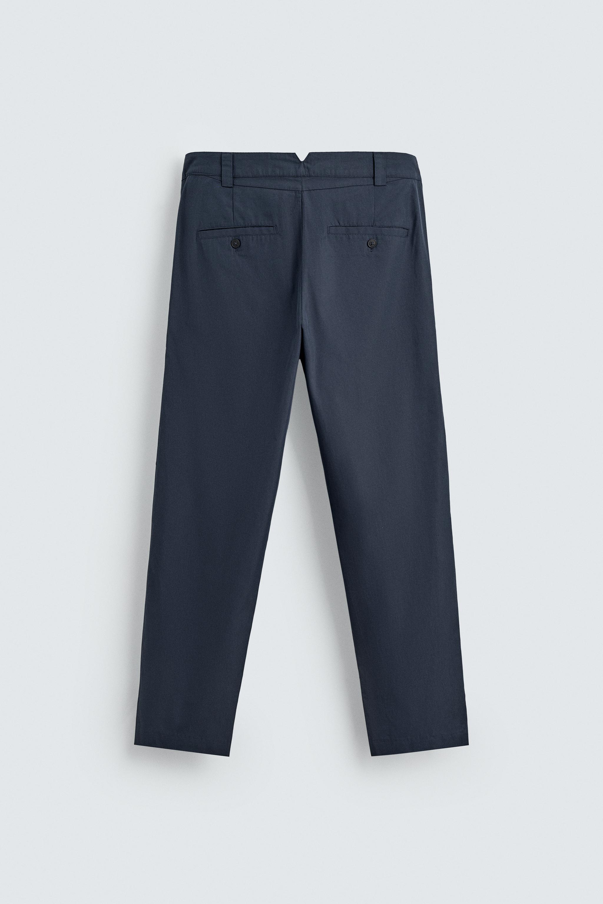 RELAXED FIT PLEATED PANTS