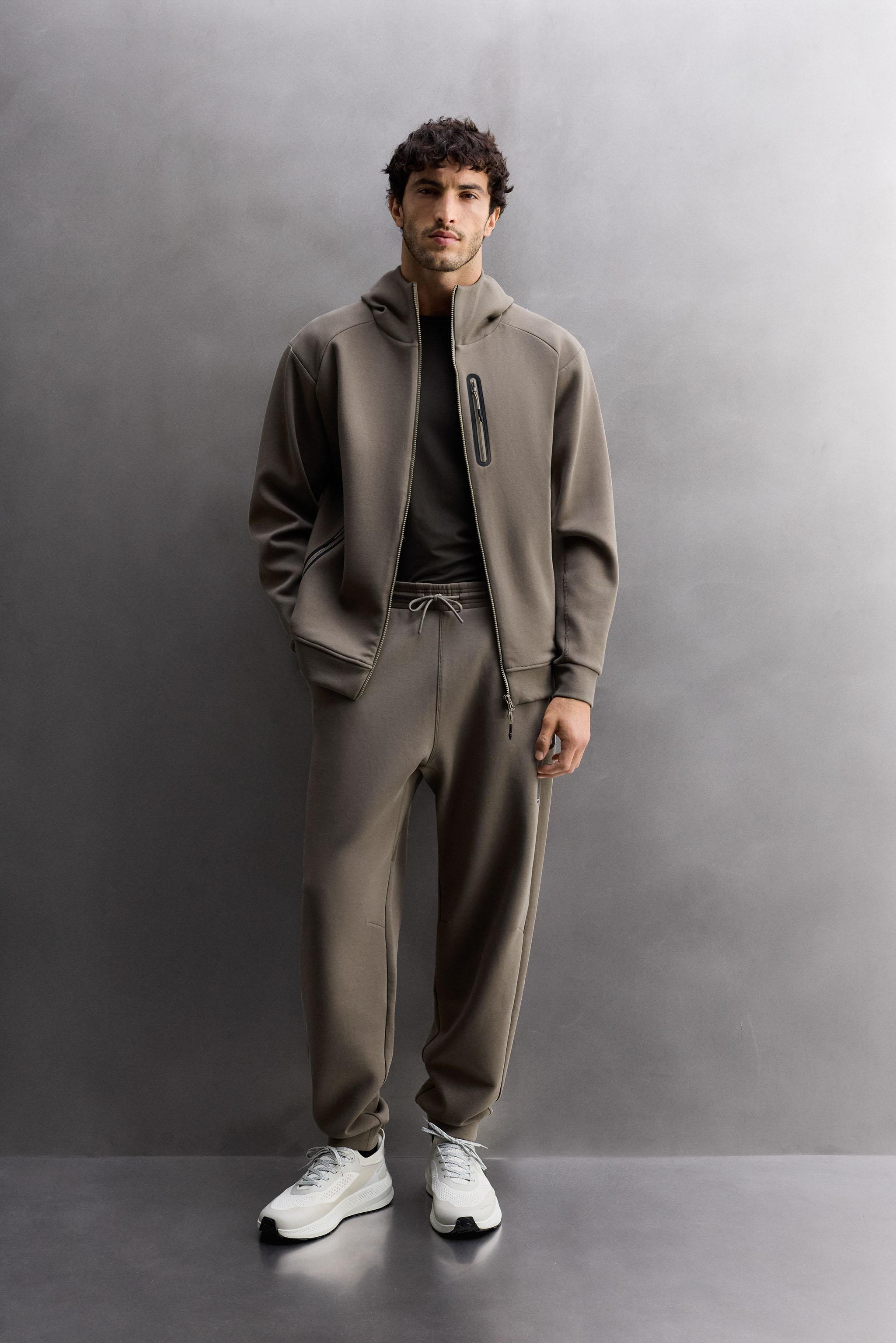 TECHNICAL ZIP-UP HOODIE