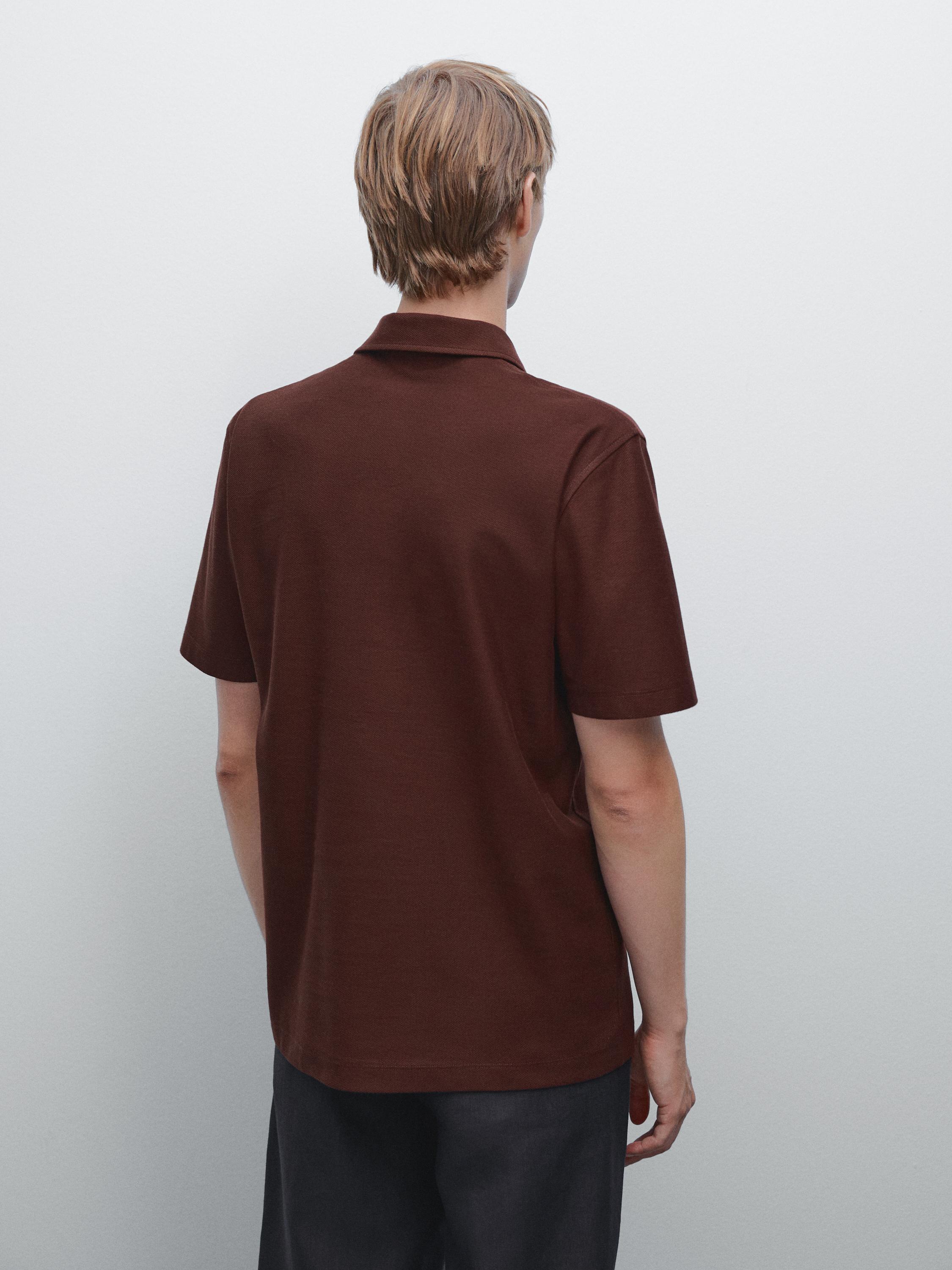 Textured polo shirt with hidden button