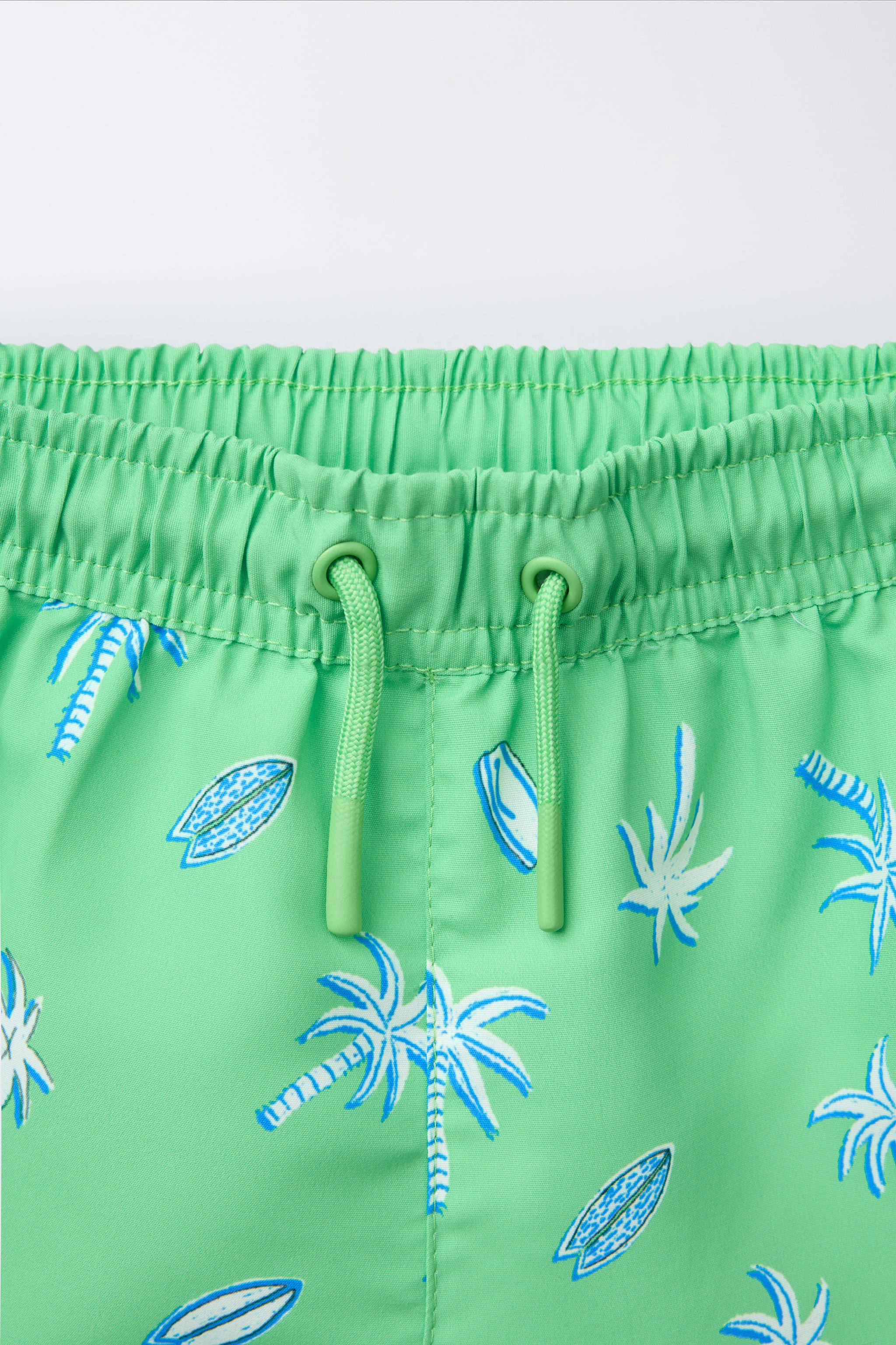 6-14 YEARS/ PALM TREE AND SURF SWIM SHORTS