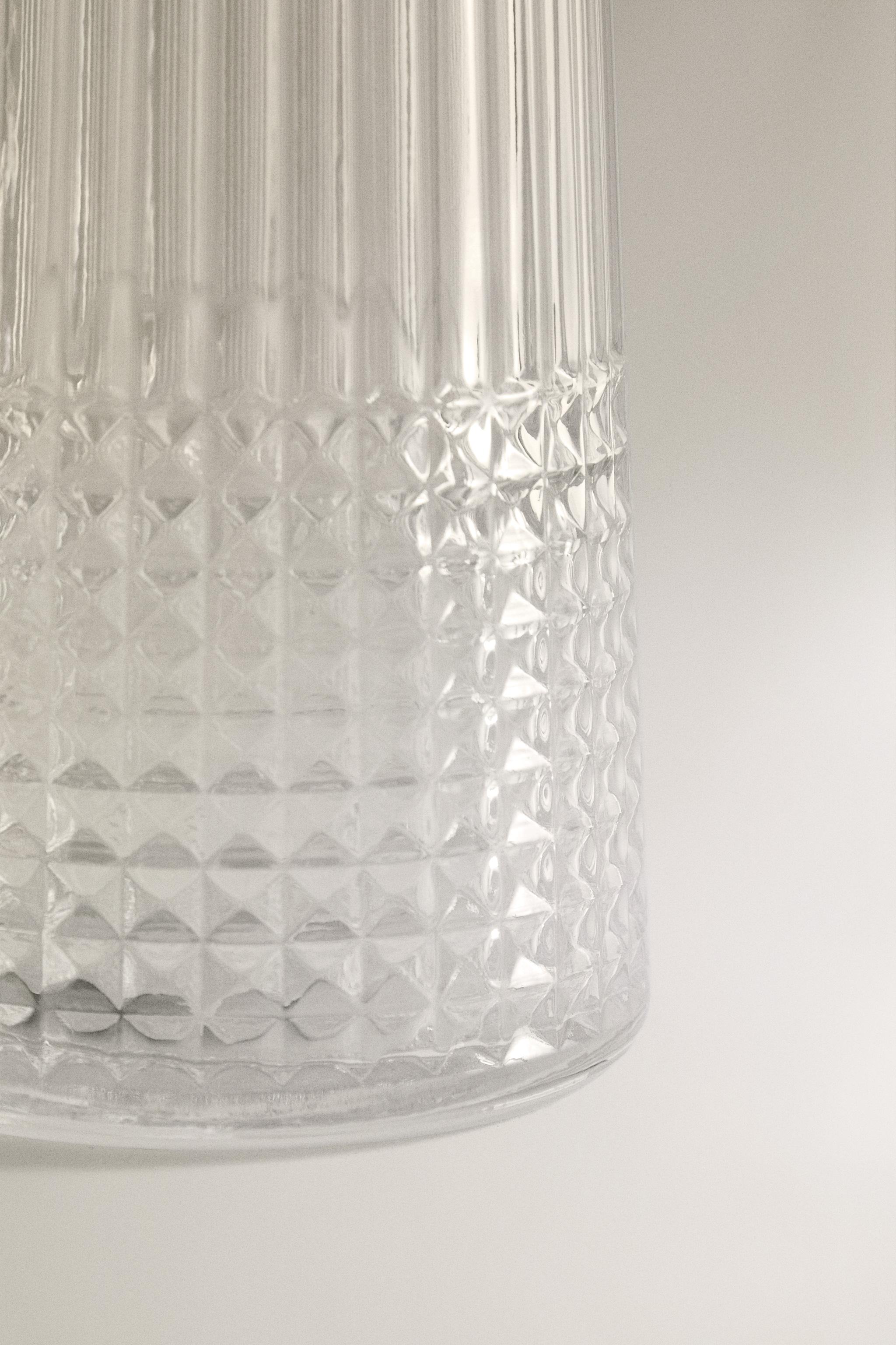 RAISED DESIGN GLASS BOTTLE