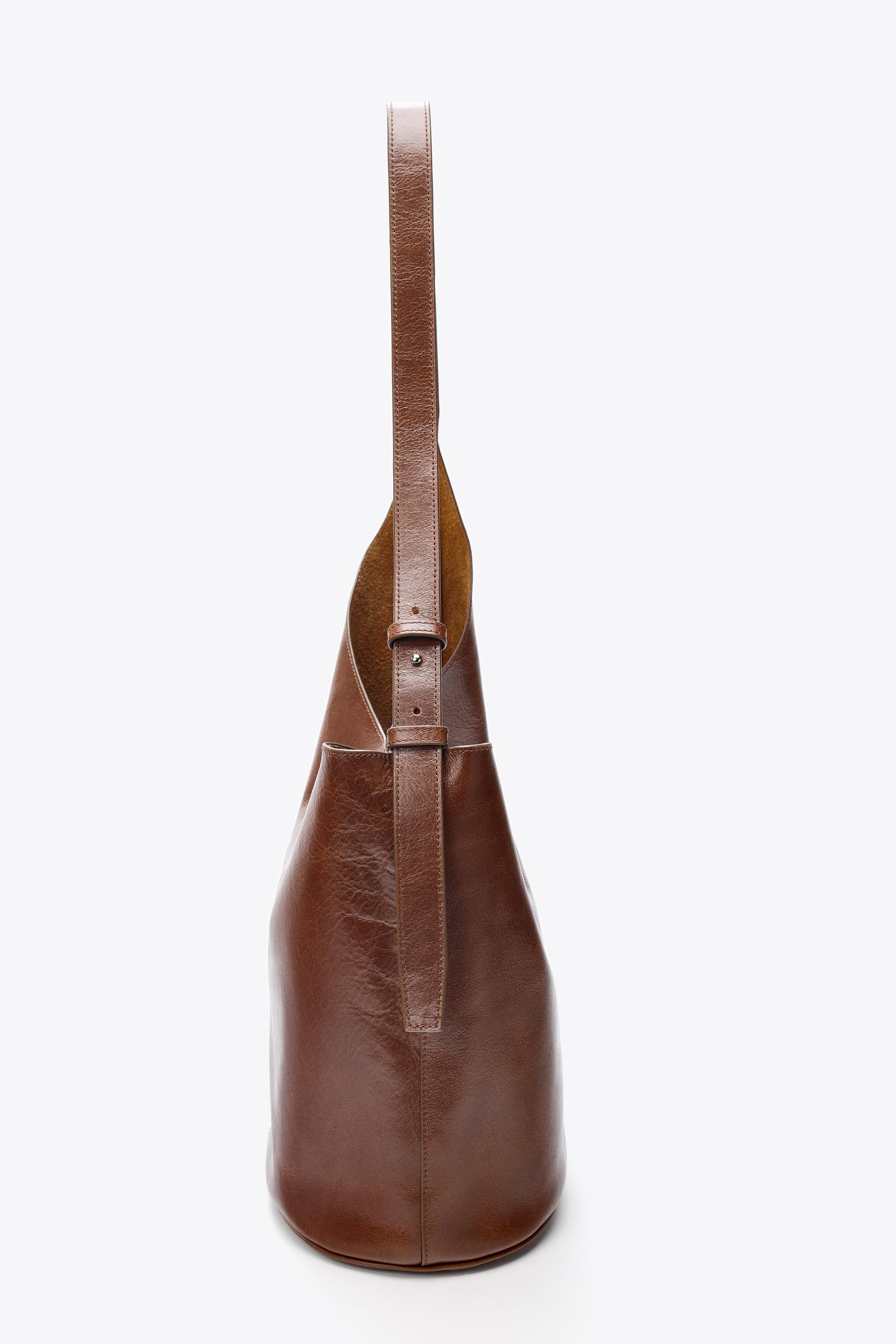 ASYMMETRIC LEATHER BUCKET BAG