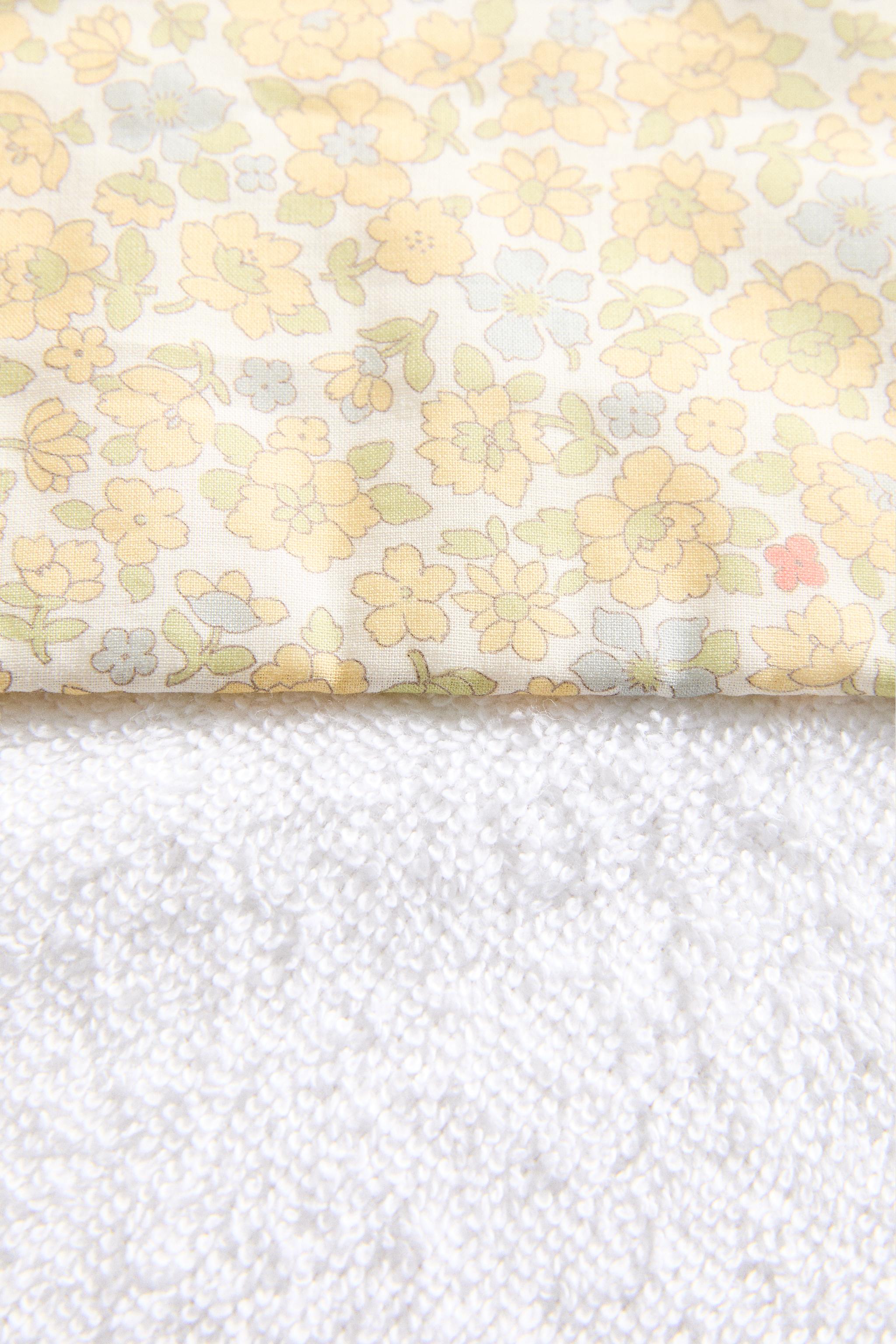 HOODED BABY BATH TOWEL WITH FLORAL PIPING AND HOOD