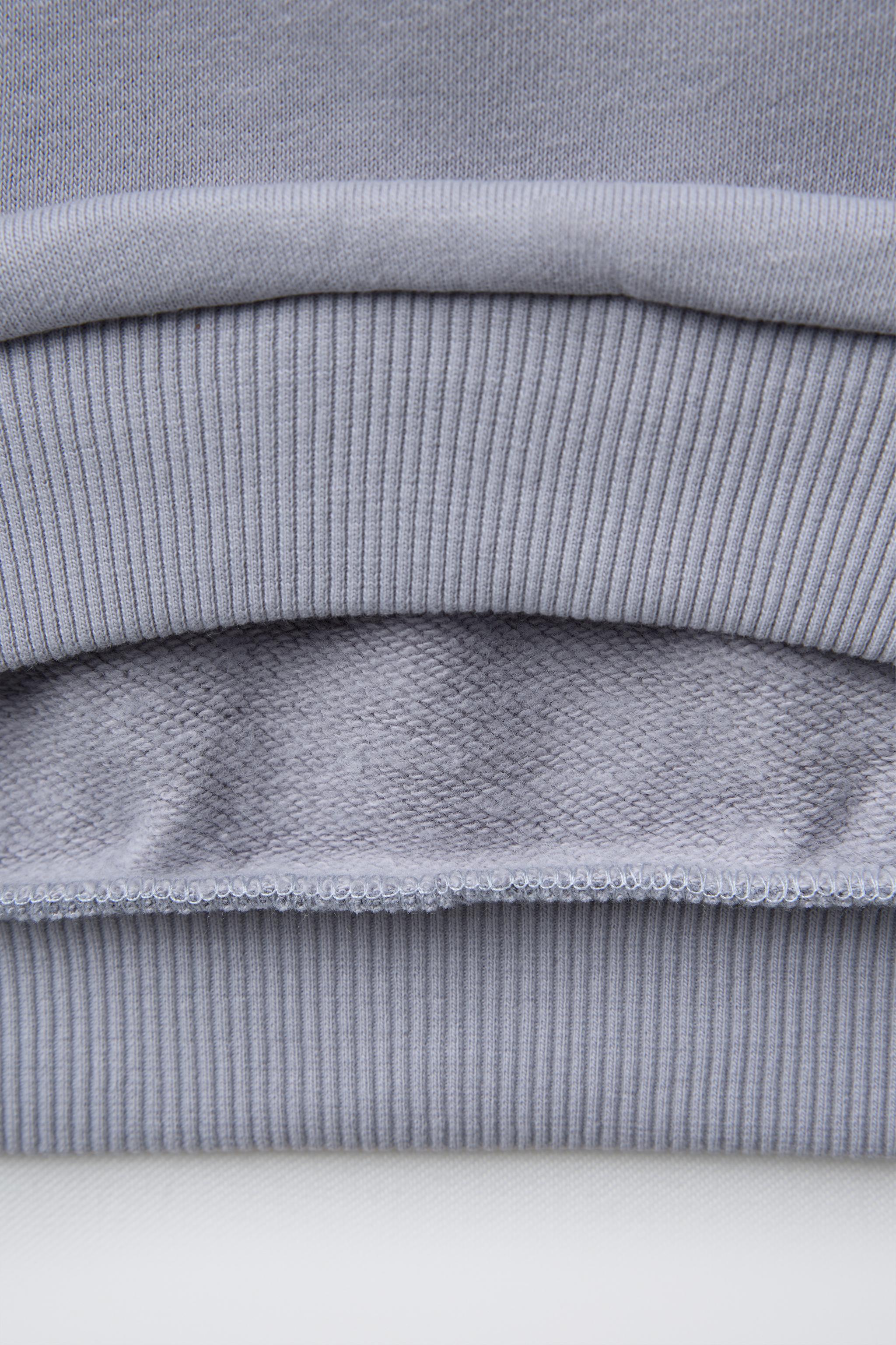 HEART POCKET SWEATSHIRT