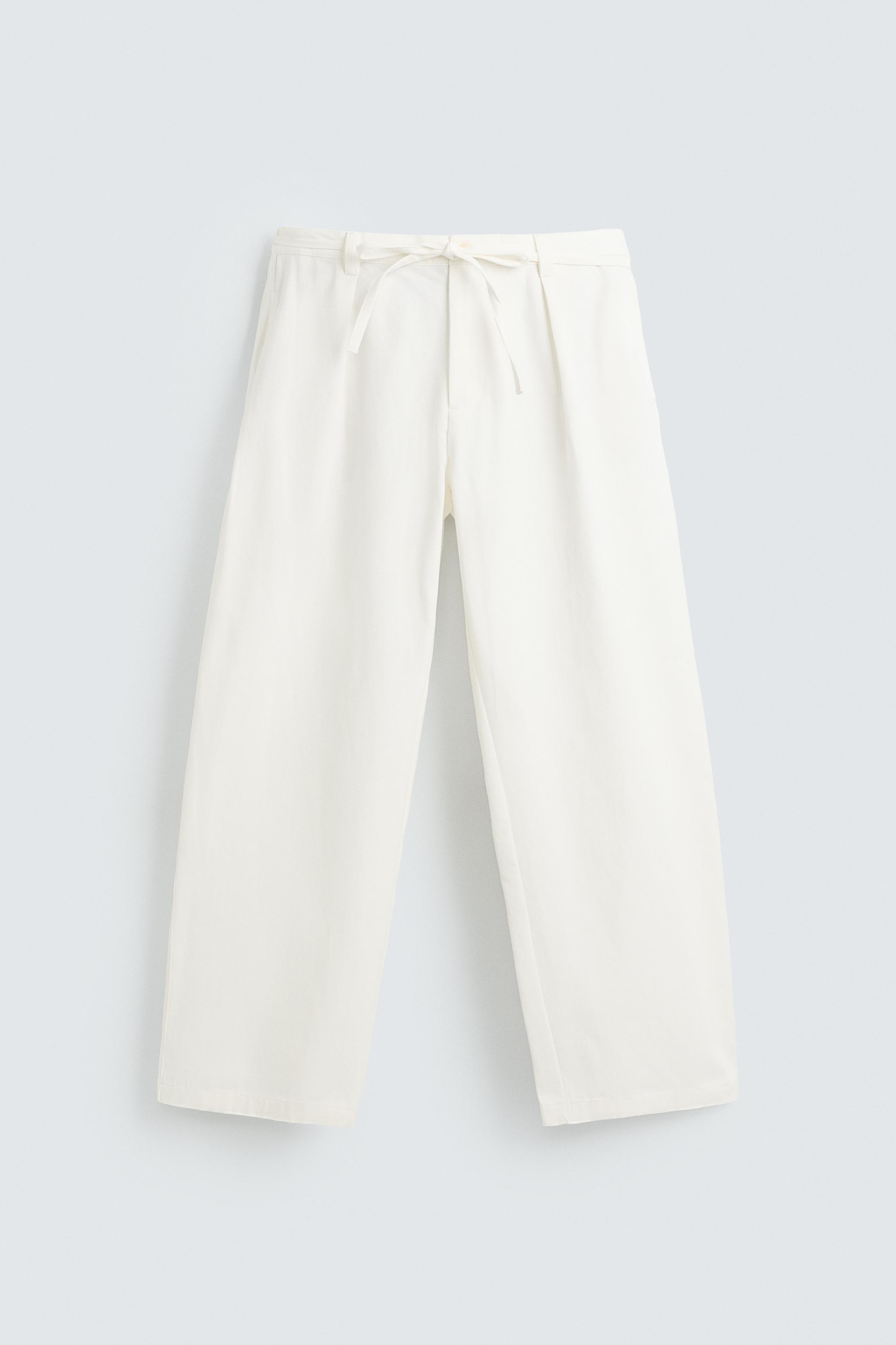 RELAXED FIT PLEATED PANTS