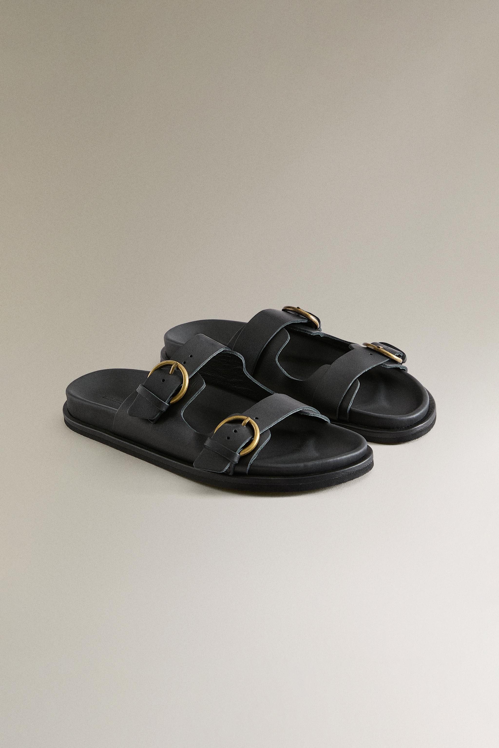 FLAT LEATHER SANDALS WITH BUCKLES