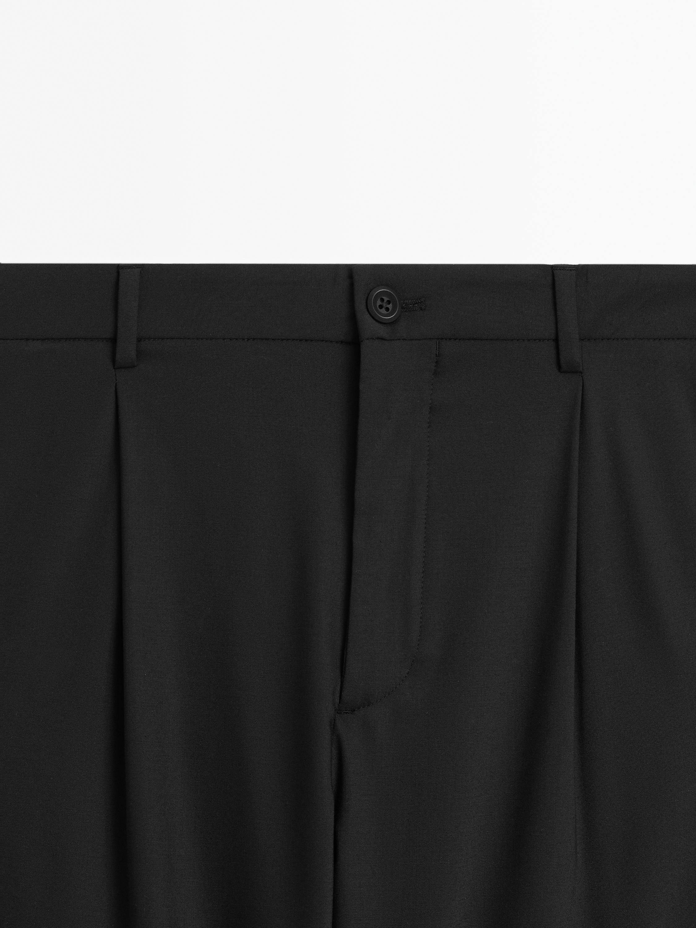 Relaxed fit trousers with darts