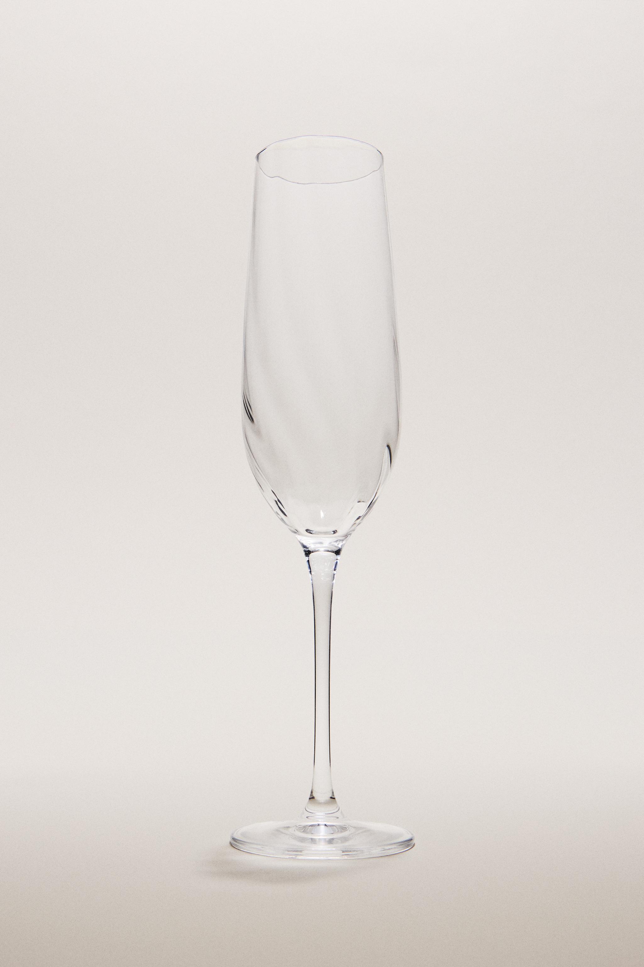 CRYSTALLINE FLUTE GLASS WITH RAISED DESIGN