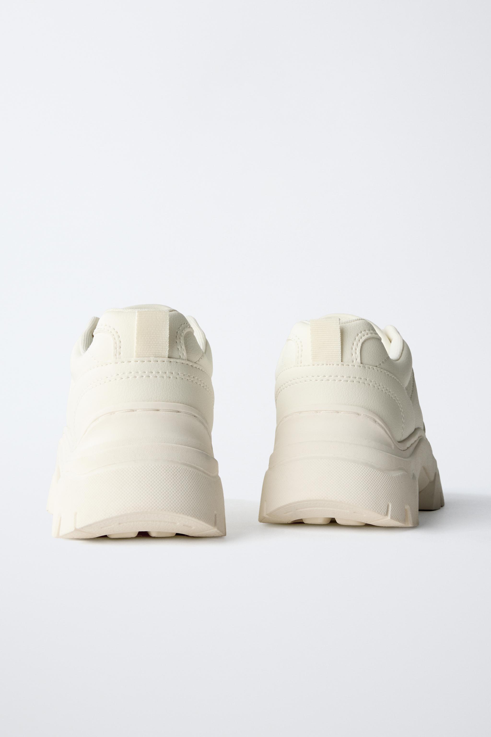 THICK-SOLED SNEAKERS WITH CHARMS