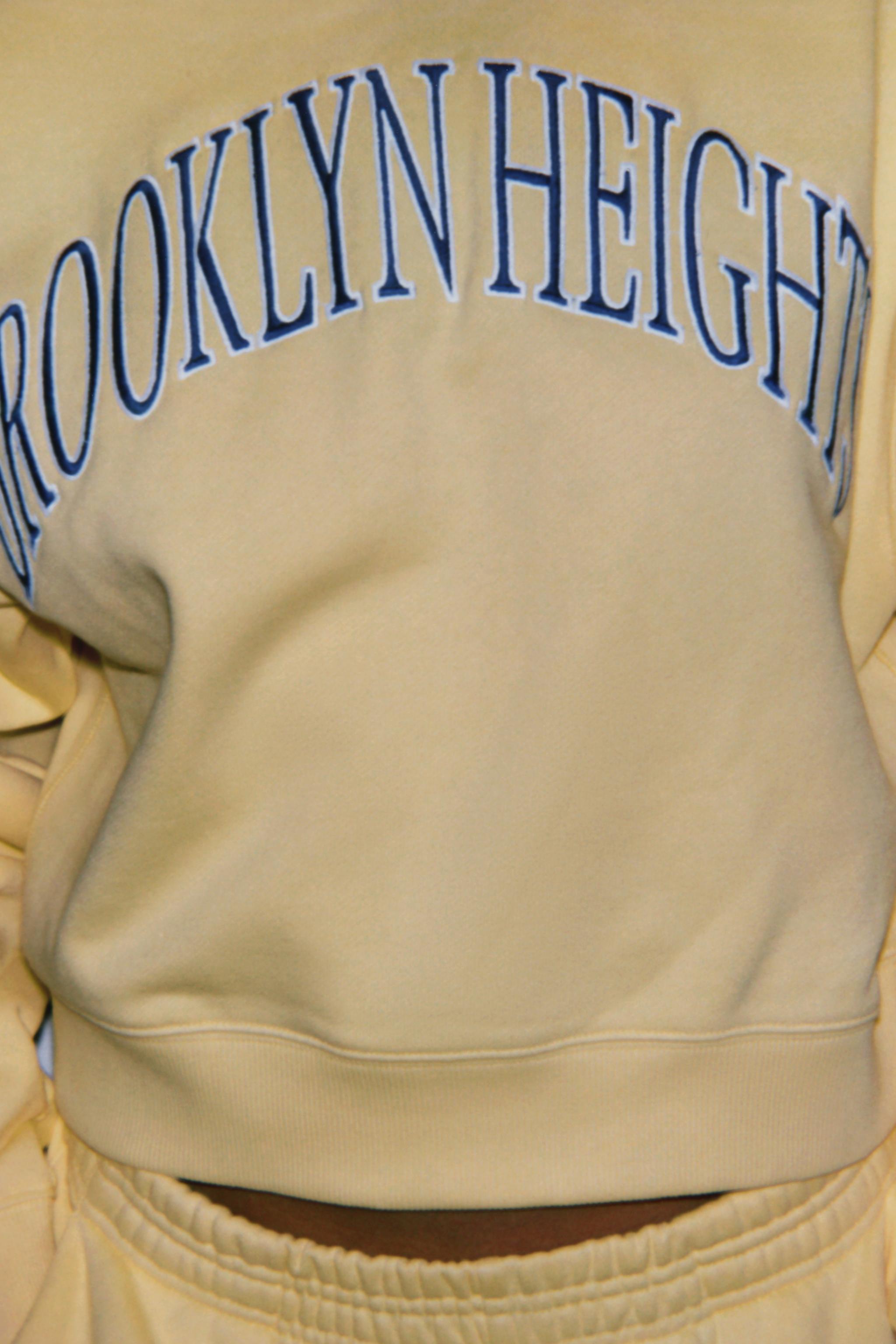 EMBROIDERED TEXT PLUSH SWEATSHIRT