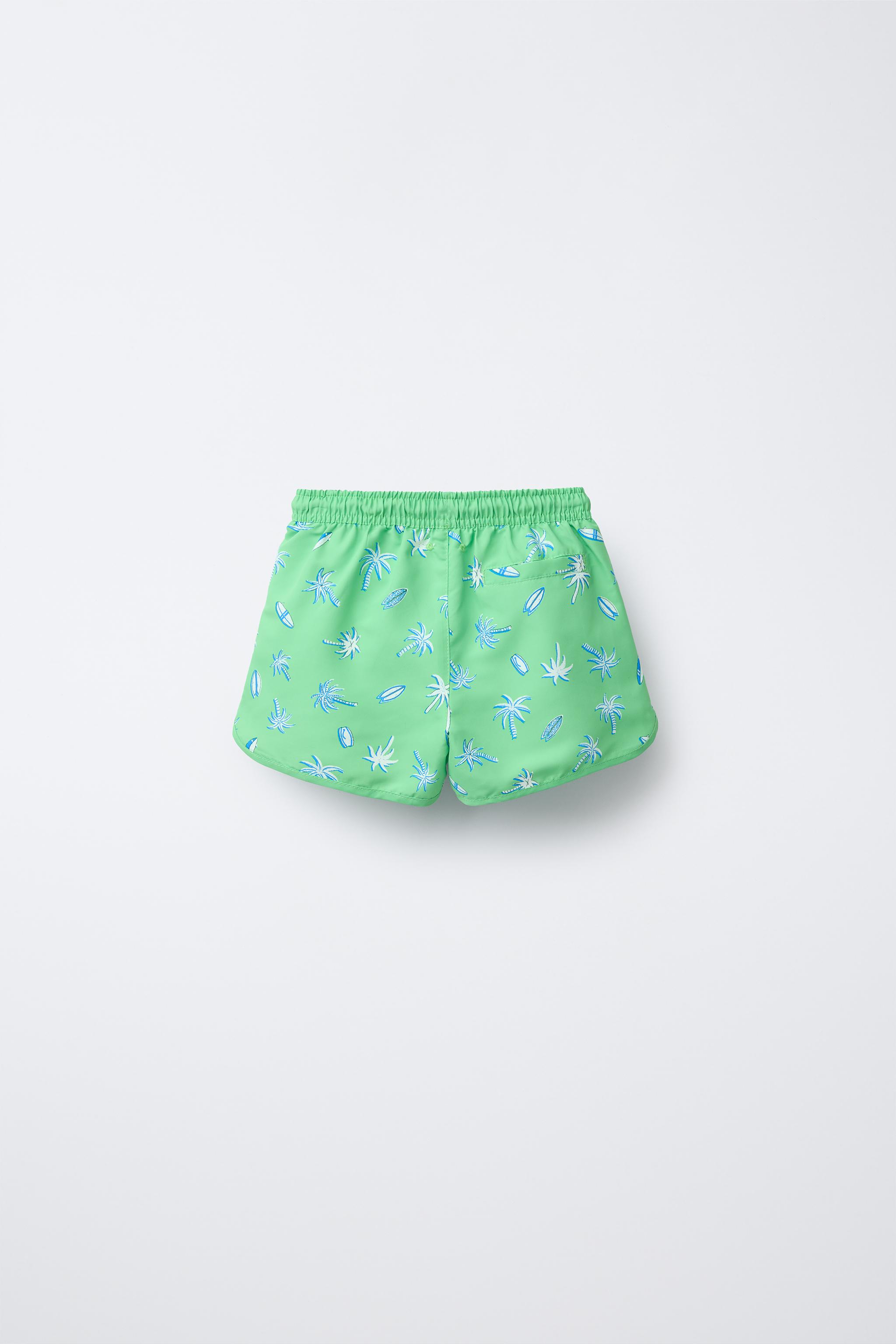 6-14 YEARS/ PALM TREE AND SURF SWIM SHORTS
