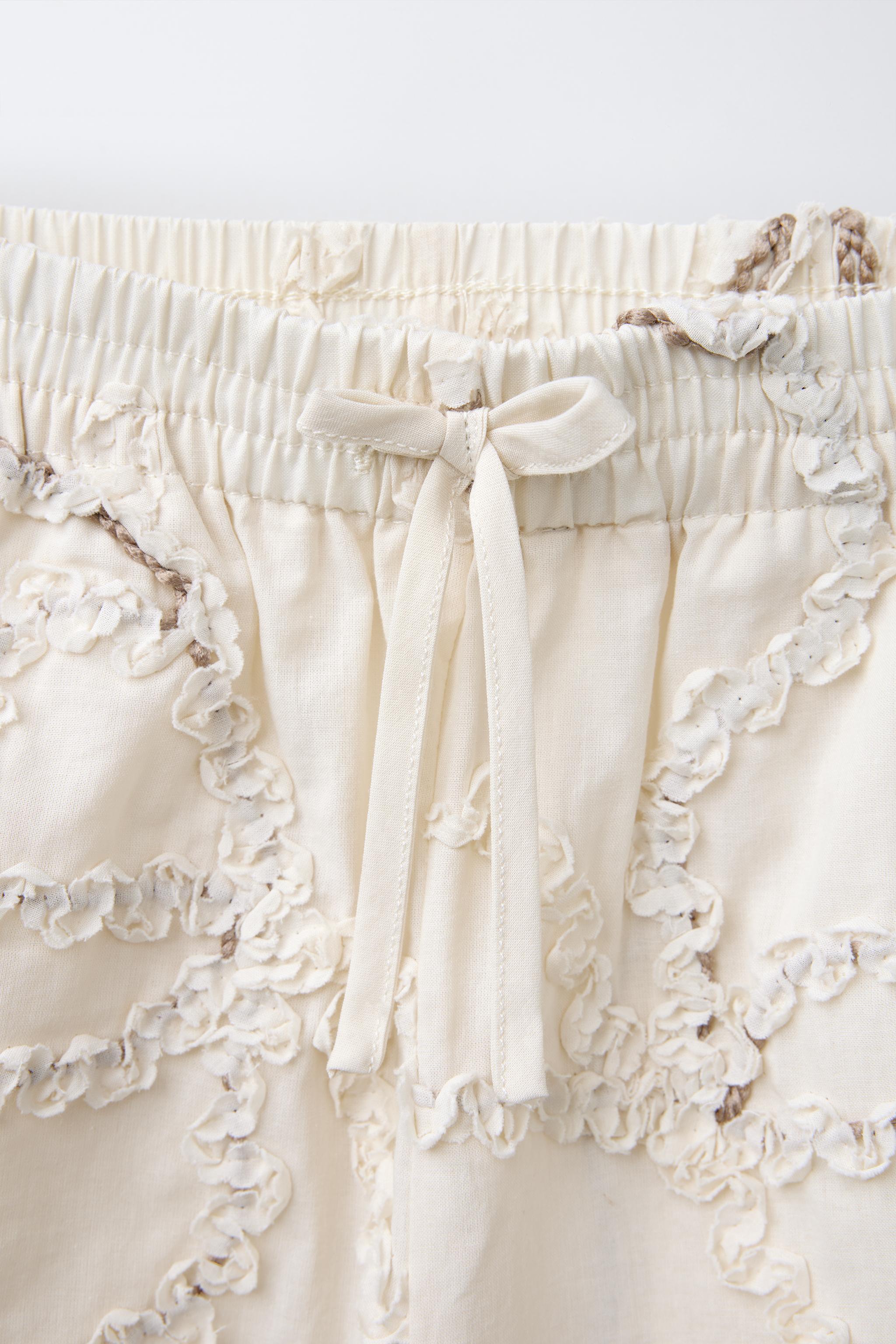 STRAIGHT LEG PANTS WITH EMBROIDERED FLOWERS