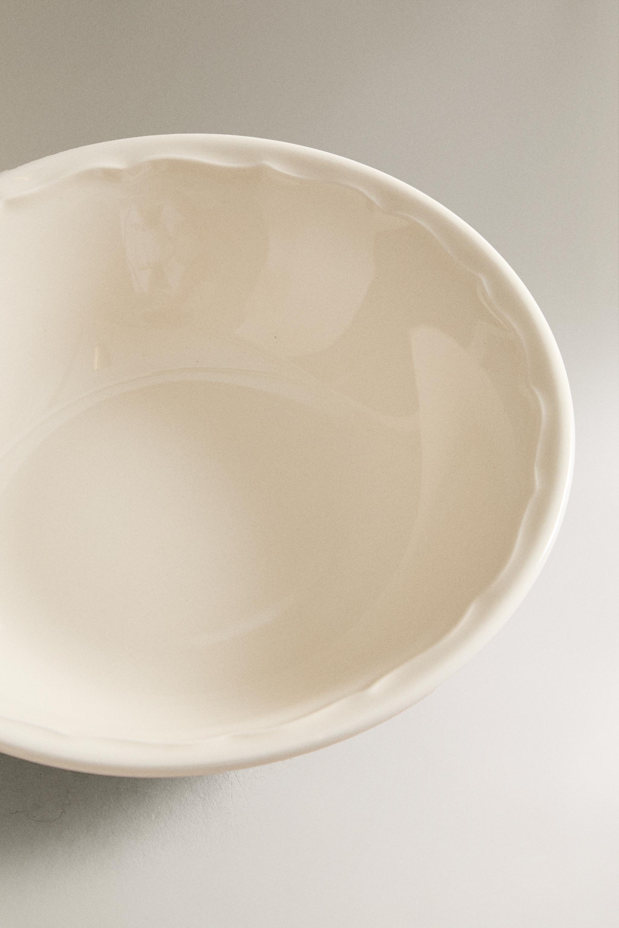 EARTHENWARE BOWL WITH RAISED-DESIGN EDGE