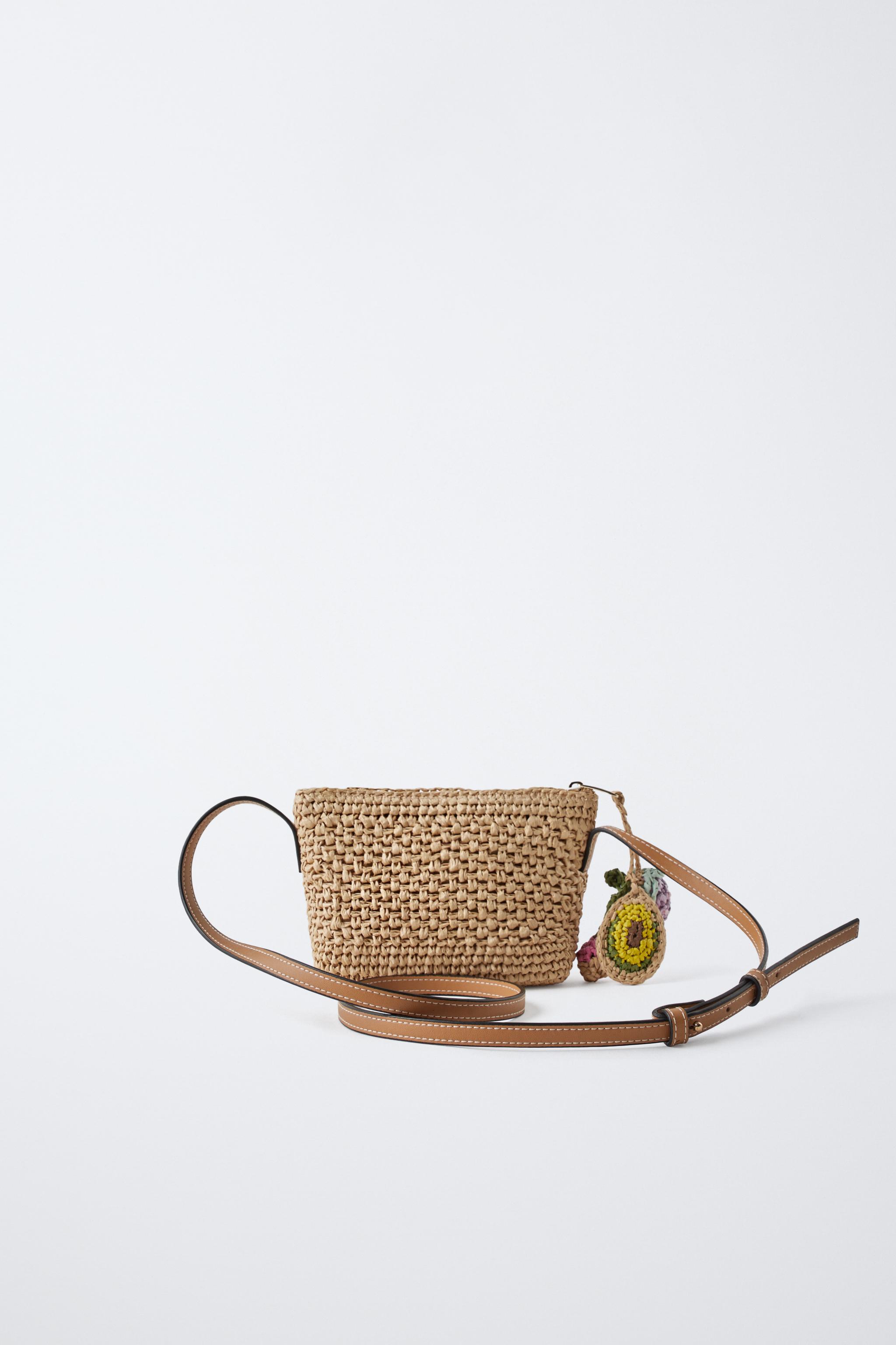 RAFFIA EFFECT CHARM CROSSBODY BAG